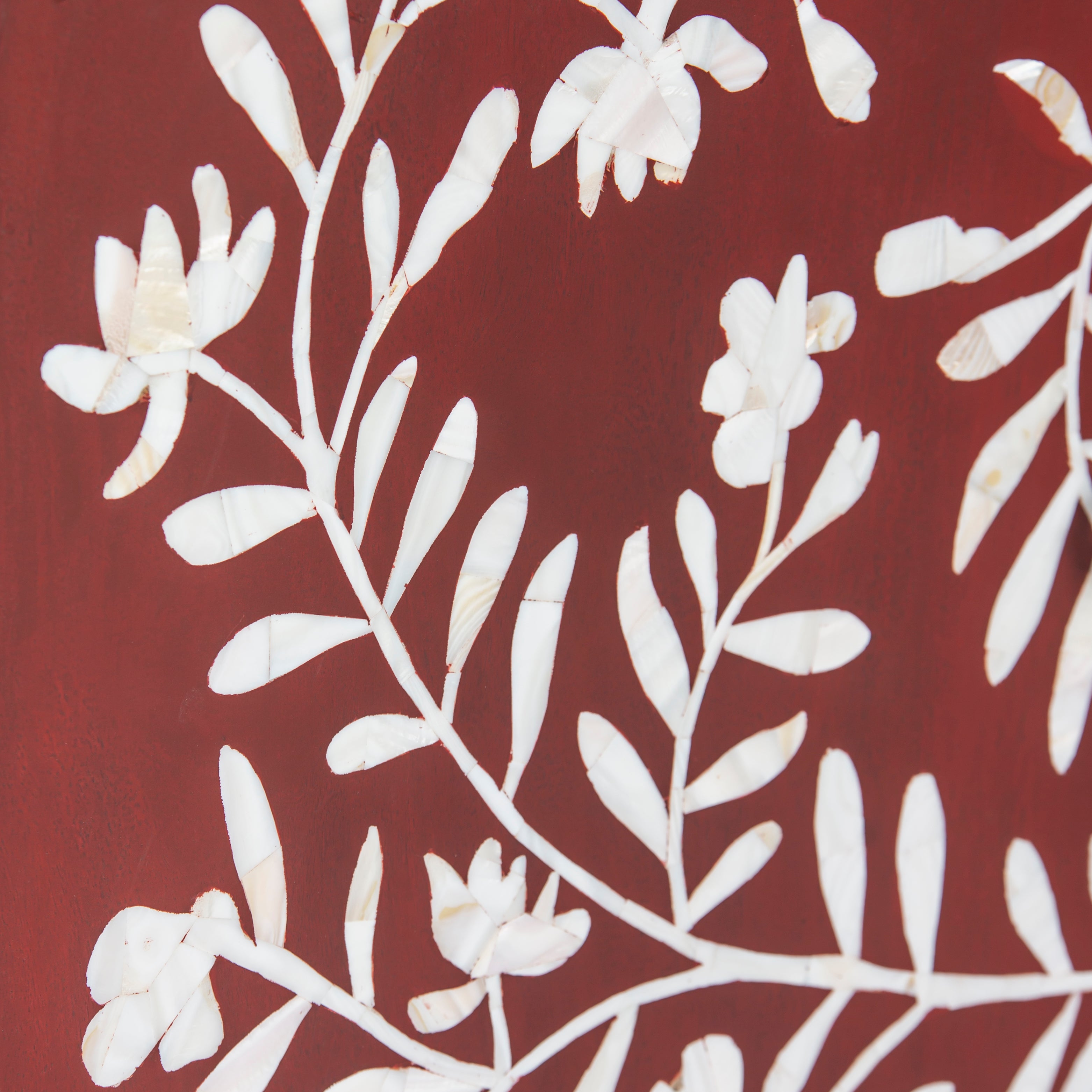 Mother of pearl inlay cabinet featuring intricate floral vine pattern in burgundy and white, handcrafted furniture piece