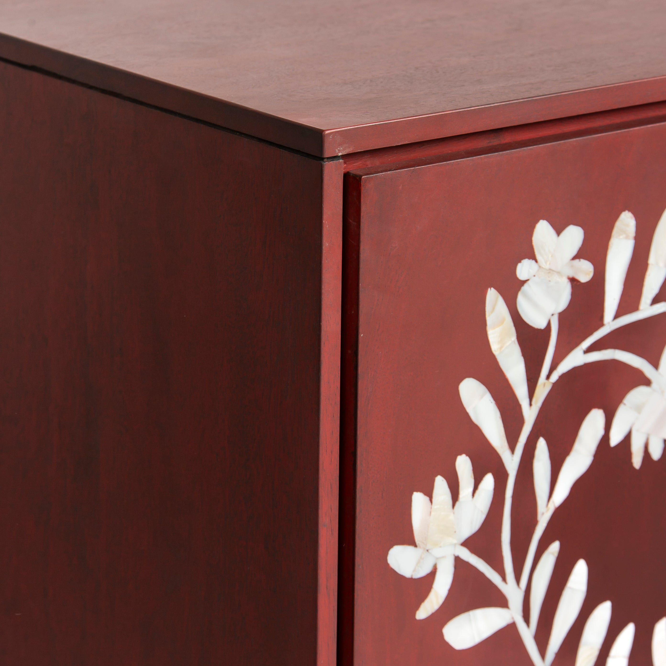 Mother of pearl inlay cabinet featuring intricate floral vine pattern in burgundy and white, handcrafted furniture piece