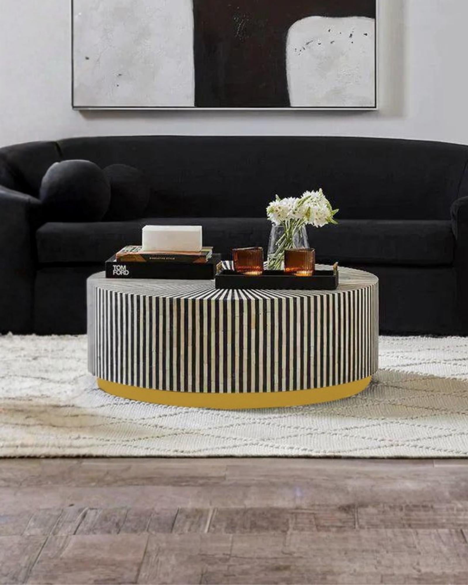 Manzil Coffee Table in black bone inlay with golden base, handcrafted with bold striped design, size 100x100x45 cm.