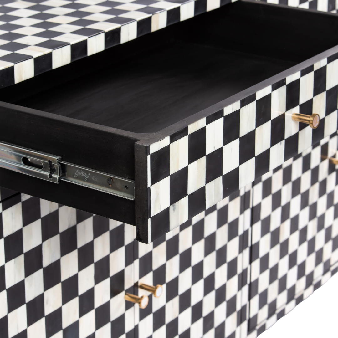 Black and white bone inlay sideboard with checkerboard pattern, featuring multiple drawers and a sleek design.