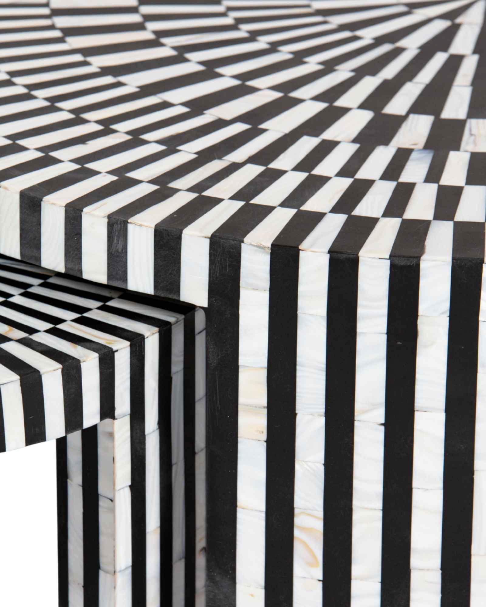 Black and white geometric mother of pearl inlay coffee table with radial top and striped base, handcrafted by Tabeer Homes.