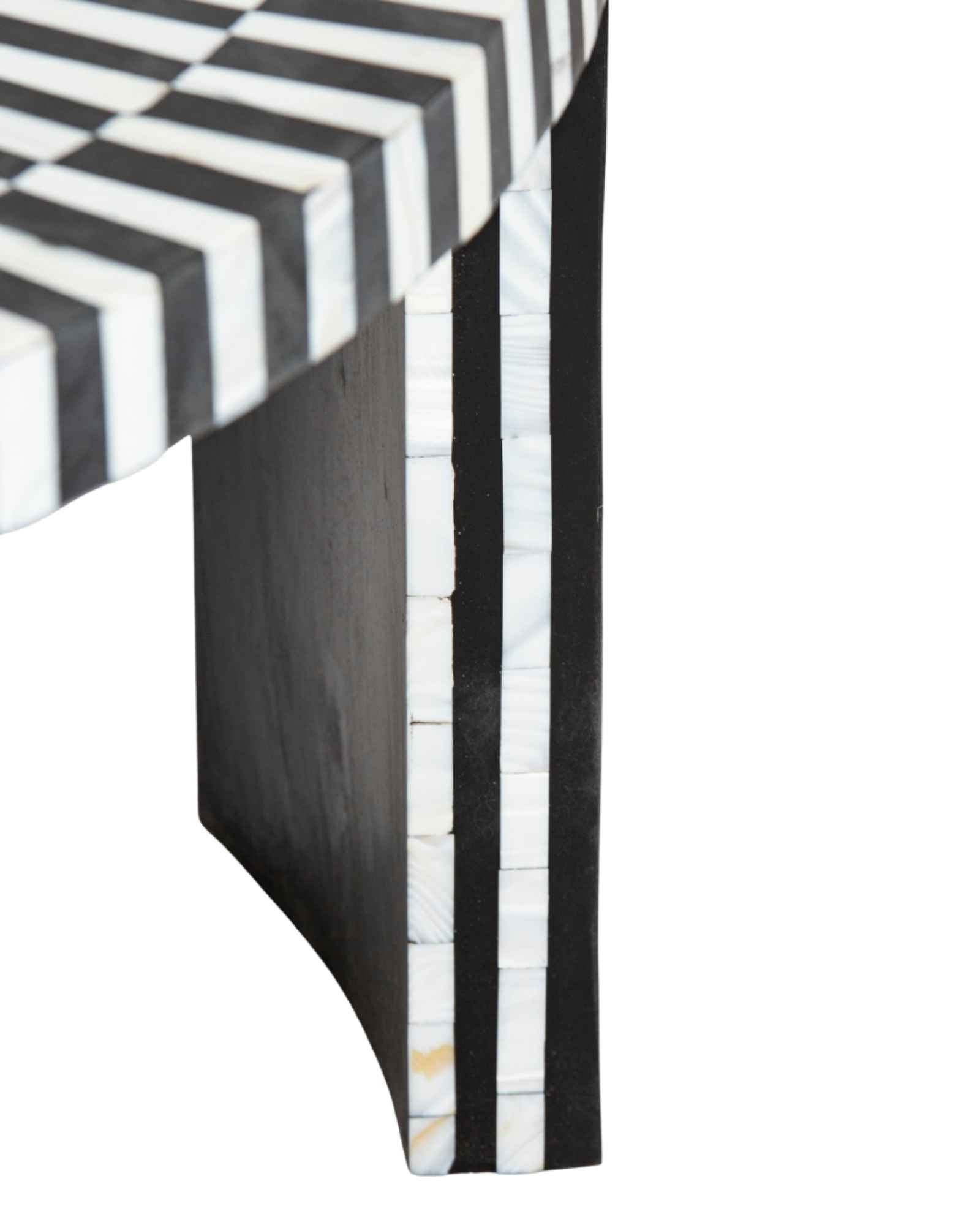 Black and white geometric mother of pearl inlay coffee table with radial top and striped base, handcrafted by Tabeer Homes.