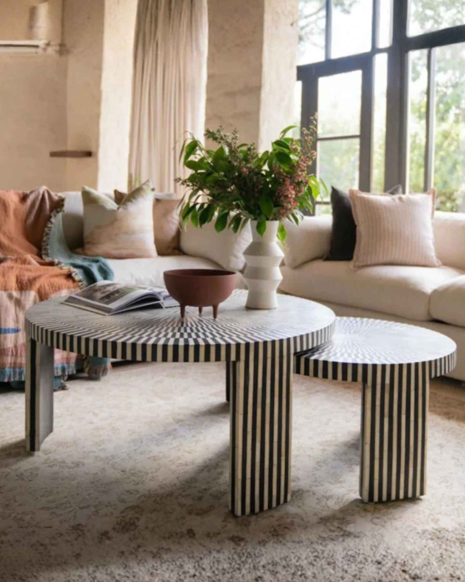 Discover the Saphed Nesting Coffee Table, handcrafted in black and white bone inlay. A striking sunburst design perfect for modern and luxury interiors.