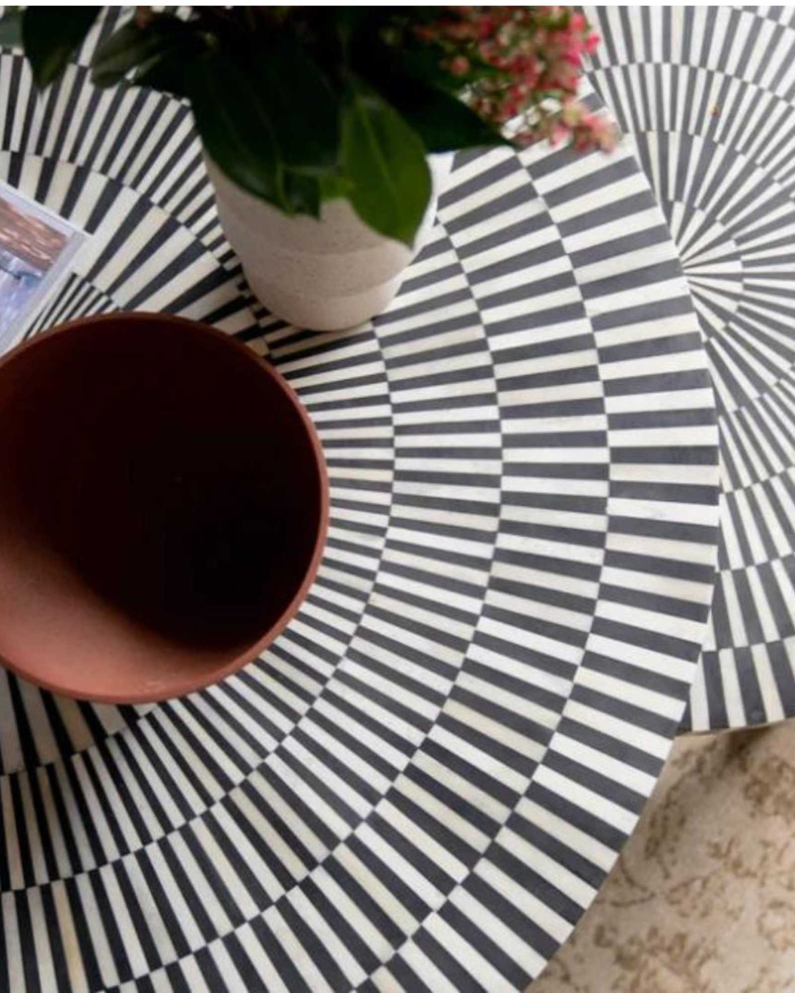 Discover the Saphed Nesting Coffee Table, handcrafted in black and white bone inlay. A striking sunburst design perfect for modern and luxury interiors.