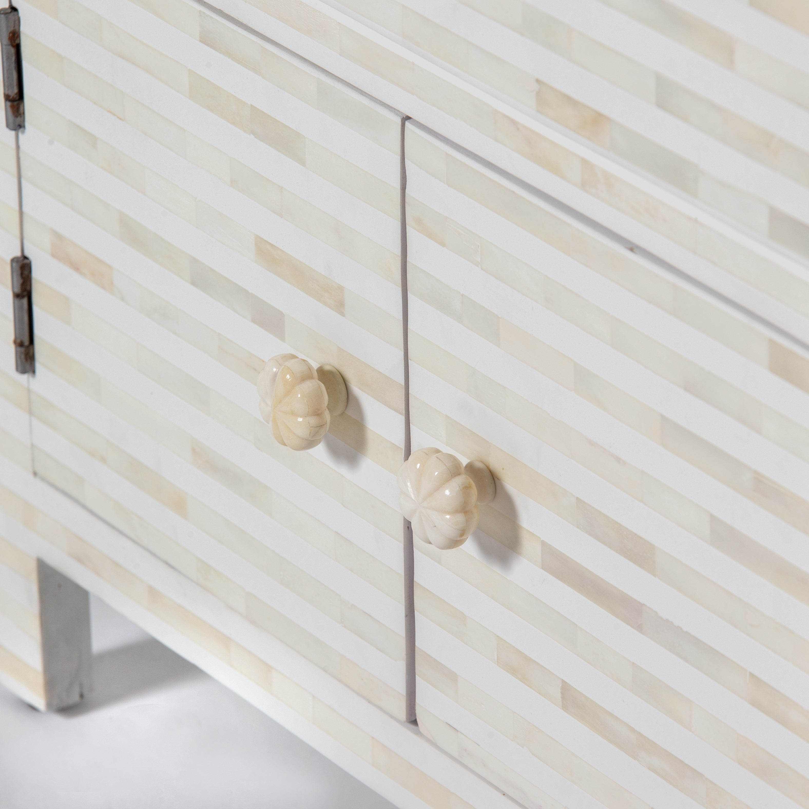 The Saphed Side Drawer features white bone inlay with cabinet doors and a drawer. A graceful accent for luxury interiors.
