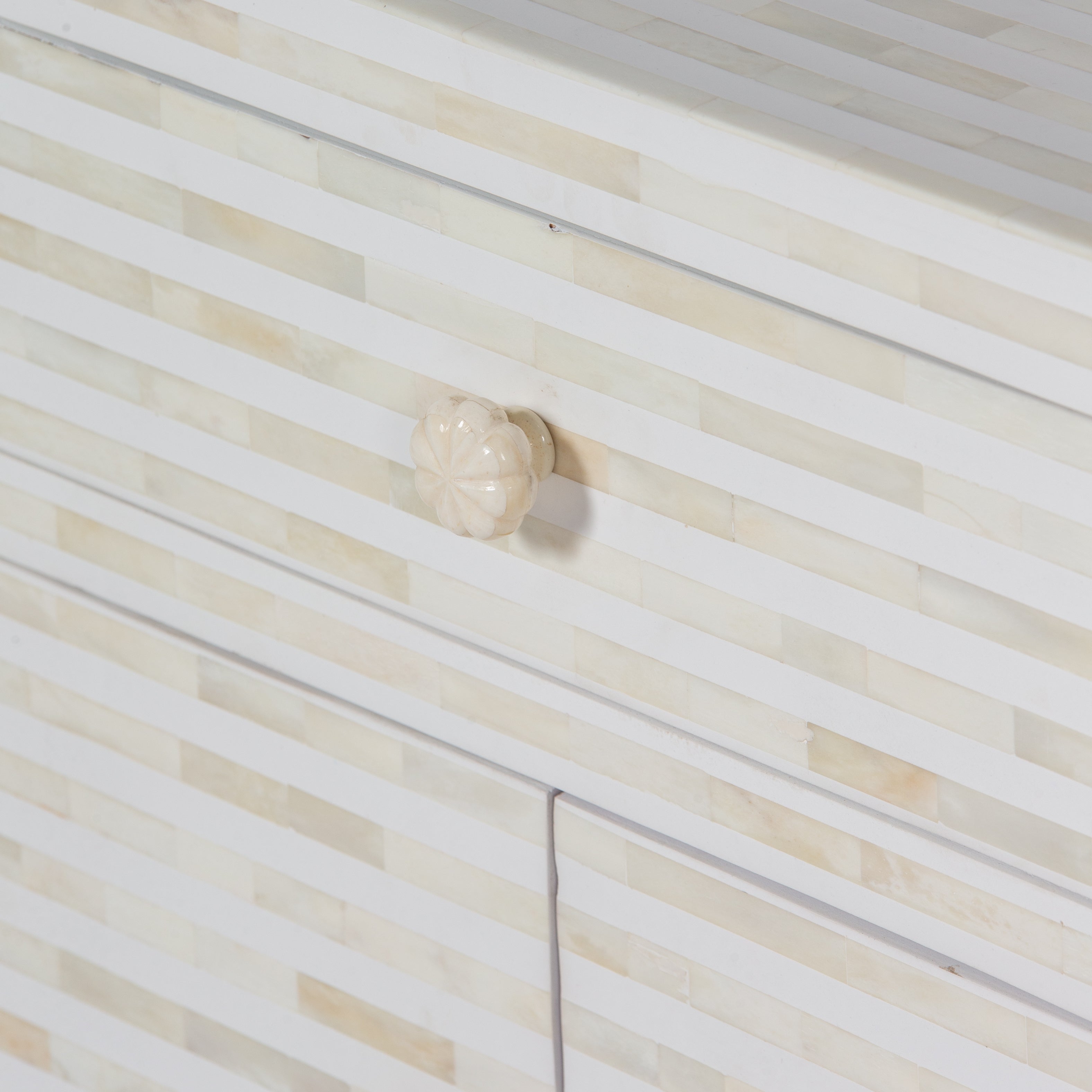 The Saphed Side Drawer features white bone inlay with cabinet doors and a drawer. A graceful accent for luxury interiors.
