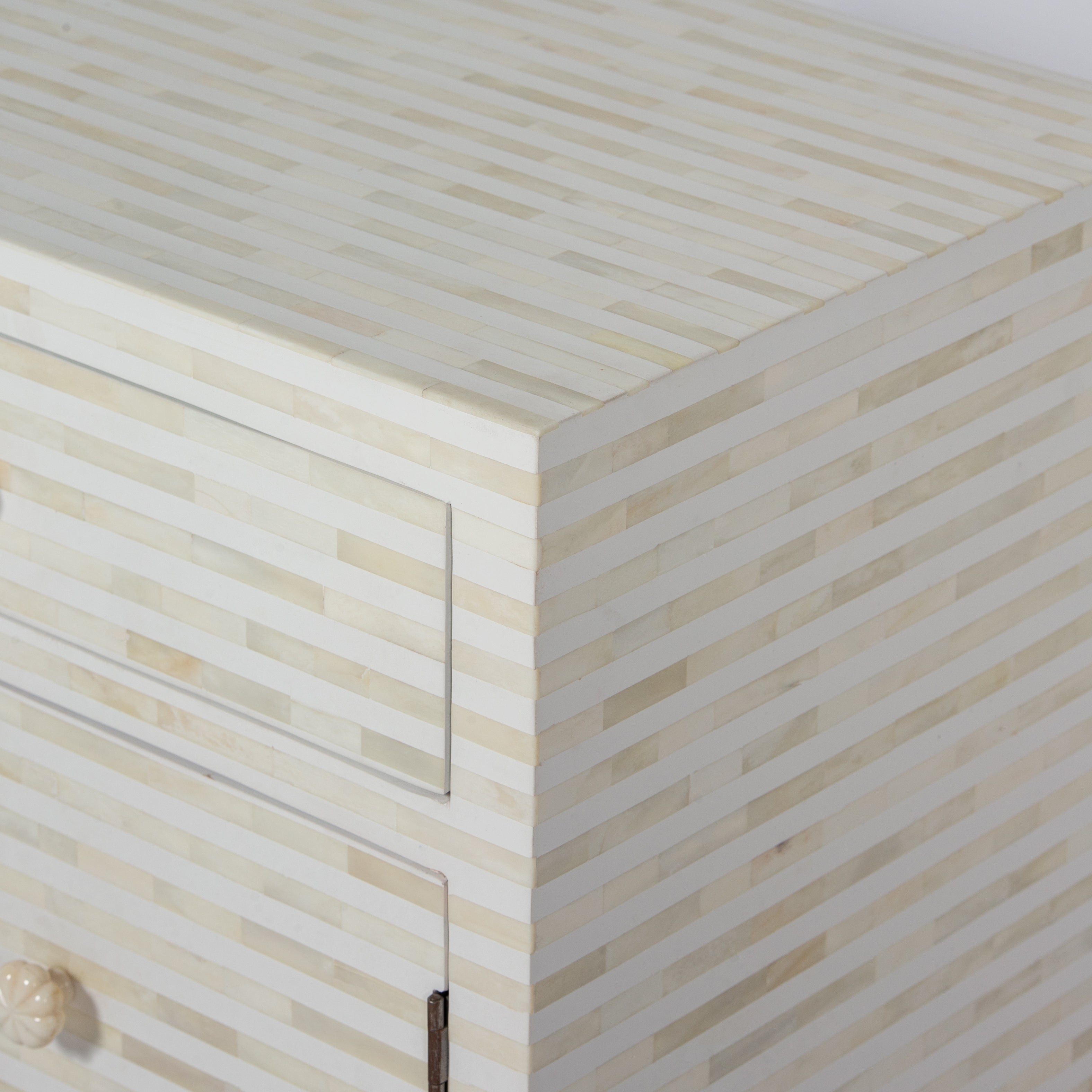 The Saphed Side Drawer features white bone inlay with cabinet doors and a drawer. A graceful accent for luxury interiors.
