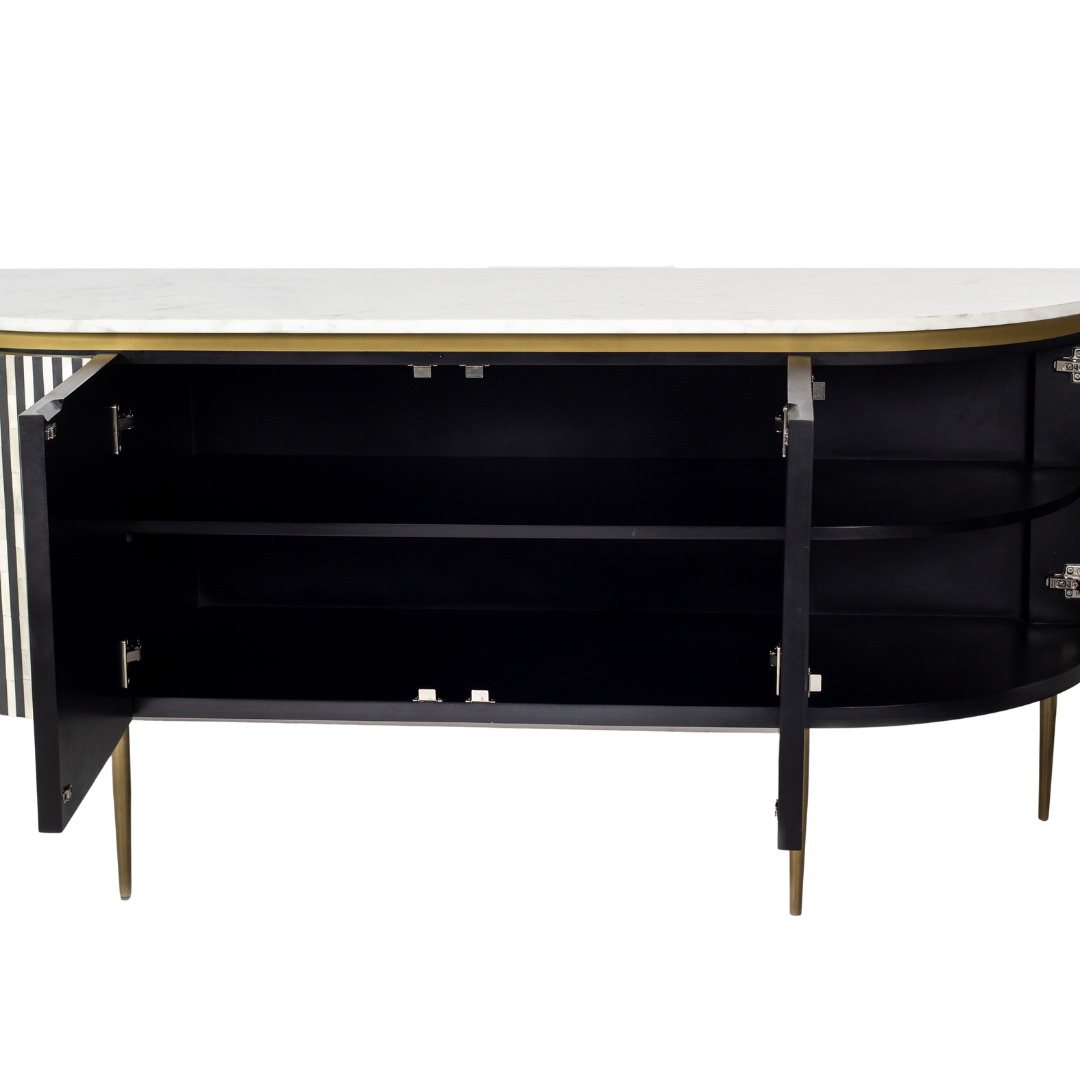 Black bone inlay sideboard with white marble top and brass legs, handcrafted with vertical striping and curved silhouette, luxury interior furniture.
