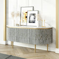 Black bone inlay sideboard with white marble top and brass legs, handcrafted with vertical striping and curved silhouette, luxury interior furniture.
