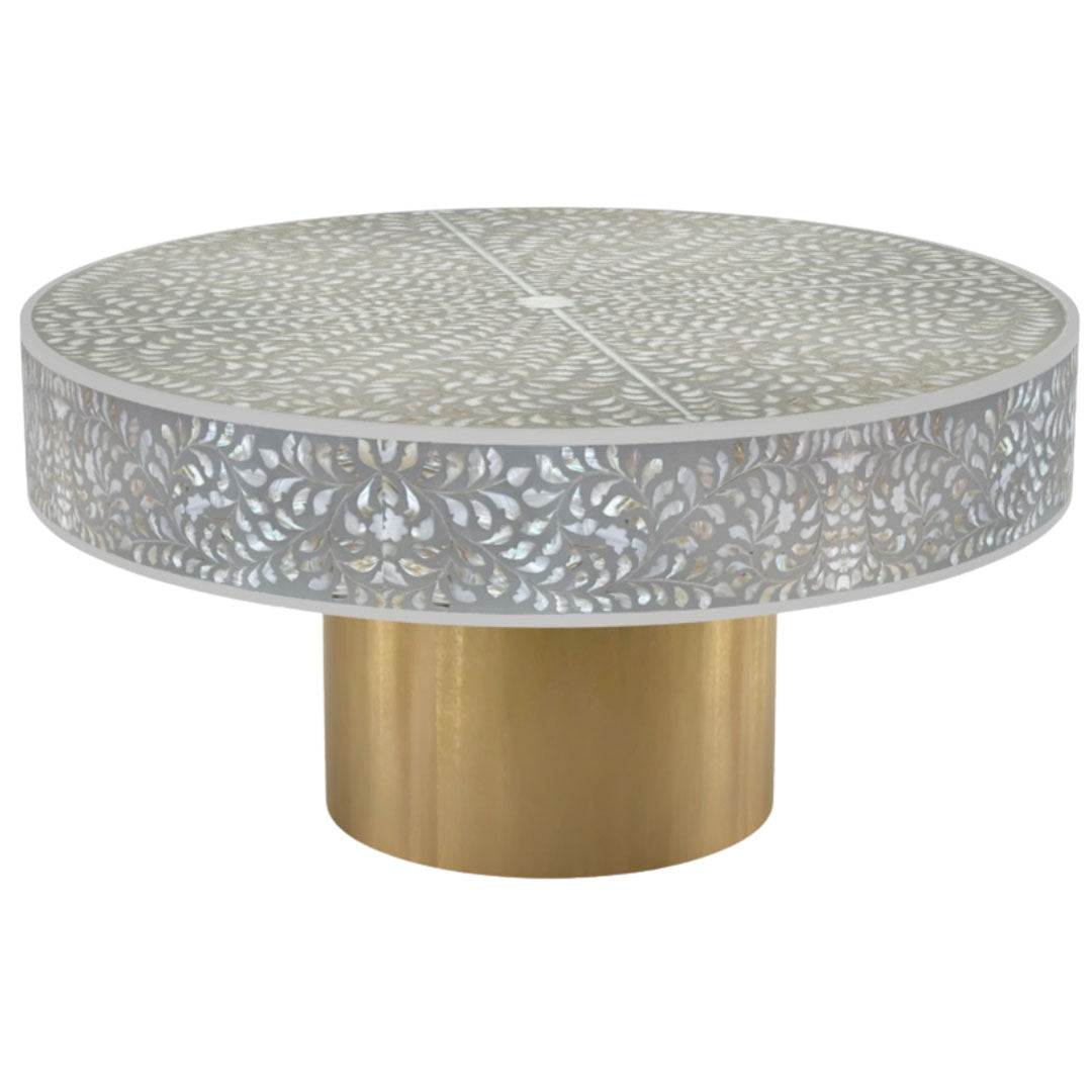 Round grey mother of pearl inlay coffee table with intricate floral design and a gold cylindrical metallic base.