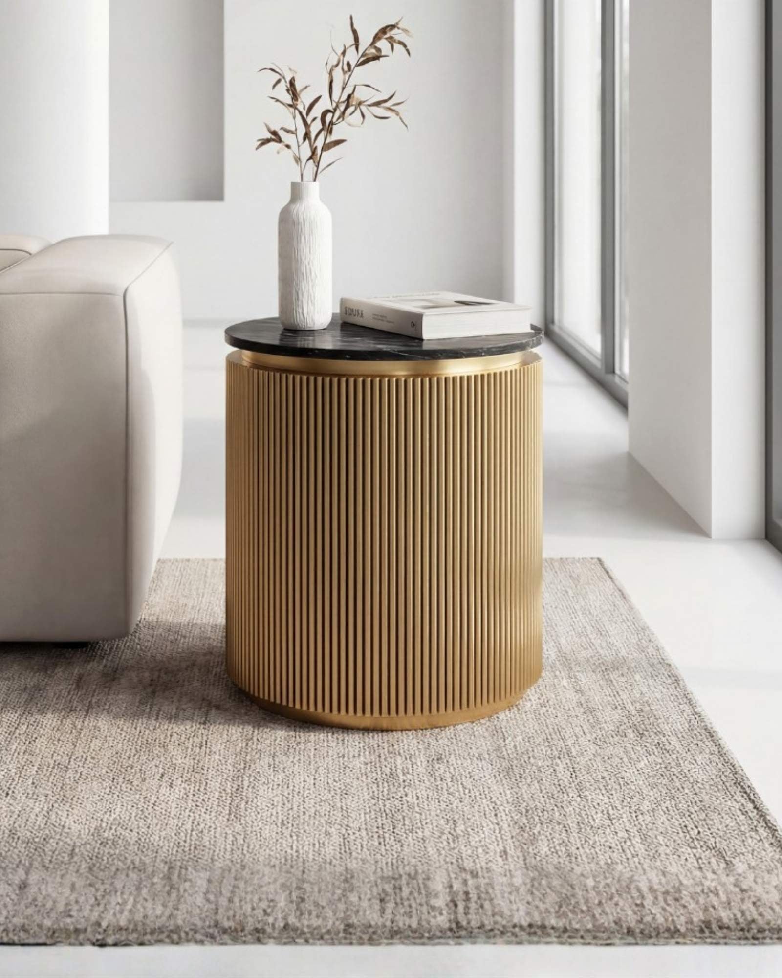 Brass clad side table featuring fluted texture with black marble top, handcrafted furniture piece.