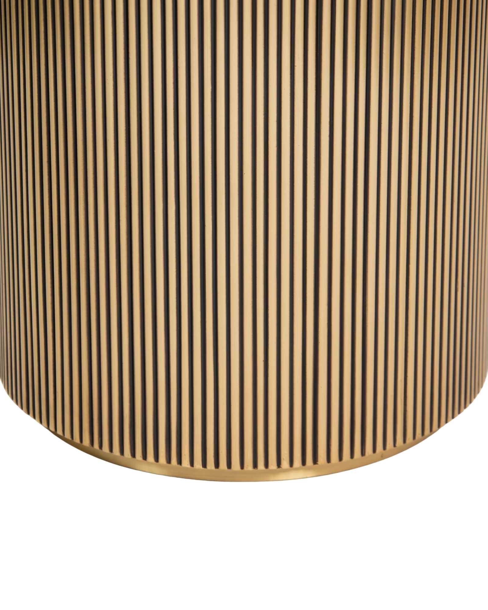 Brass clad side table featuring fluted texture with black marble top, handcrafted furniture piece.