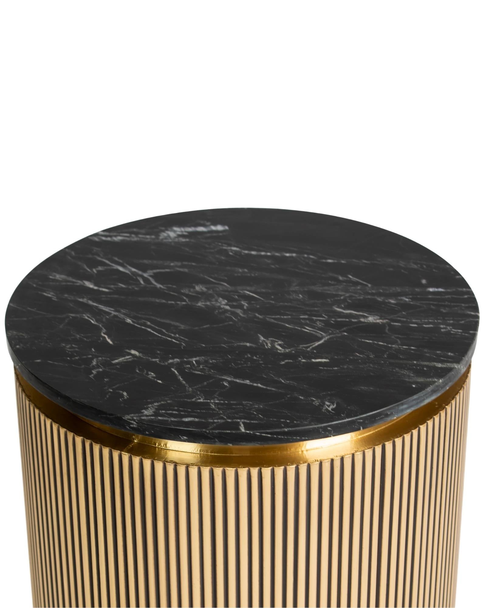 Brass clad side table featuring fluted texture with black marble top, handcrafted furniture piece.