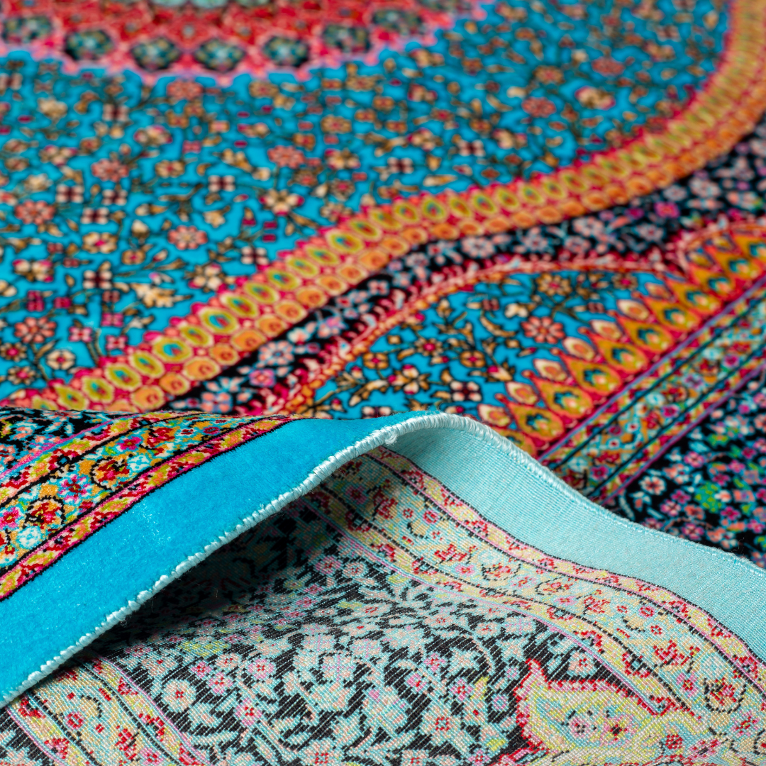 Vortex Silk Rug featuring a central floral medallion on a turquoise base with red, green, and black detailing, size 150x100 cm.