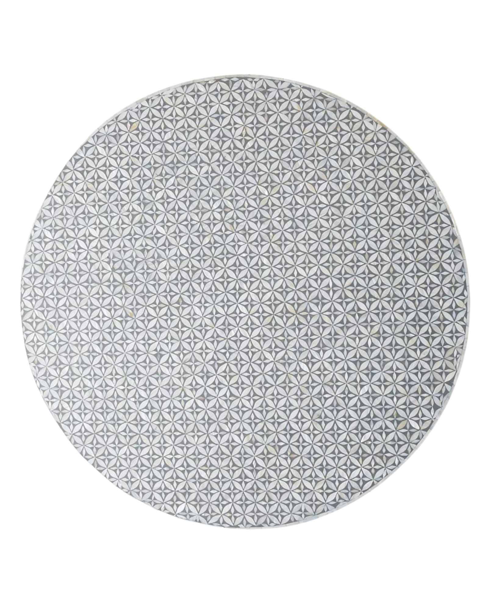 Round grey bone inlay coffee table with floral design and a bold gold base. A stylish and modern centerpiece for any living room.