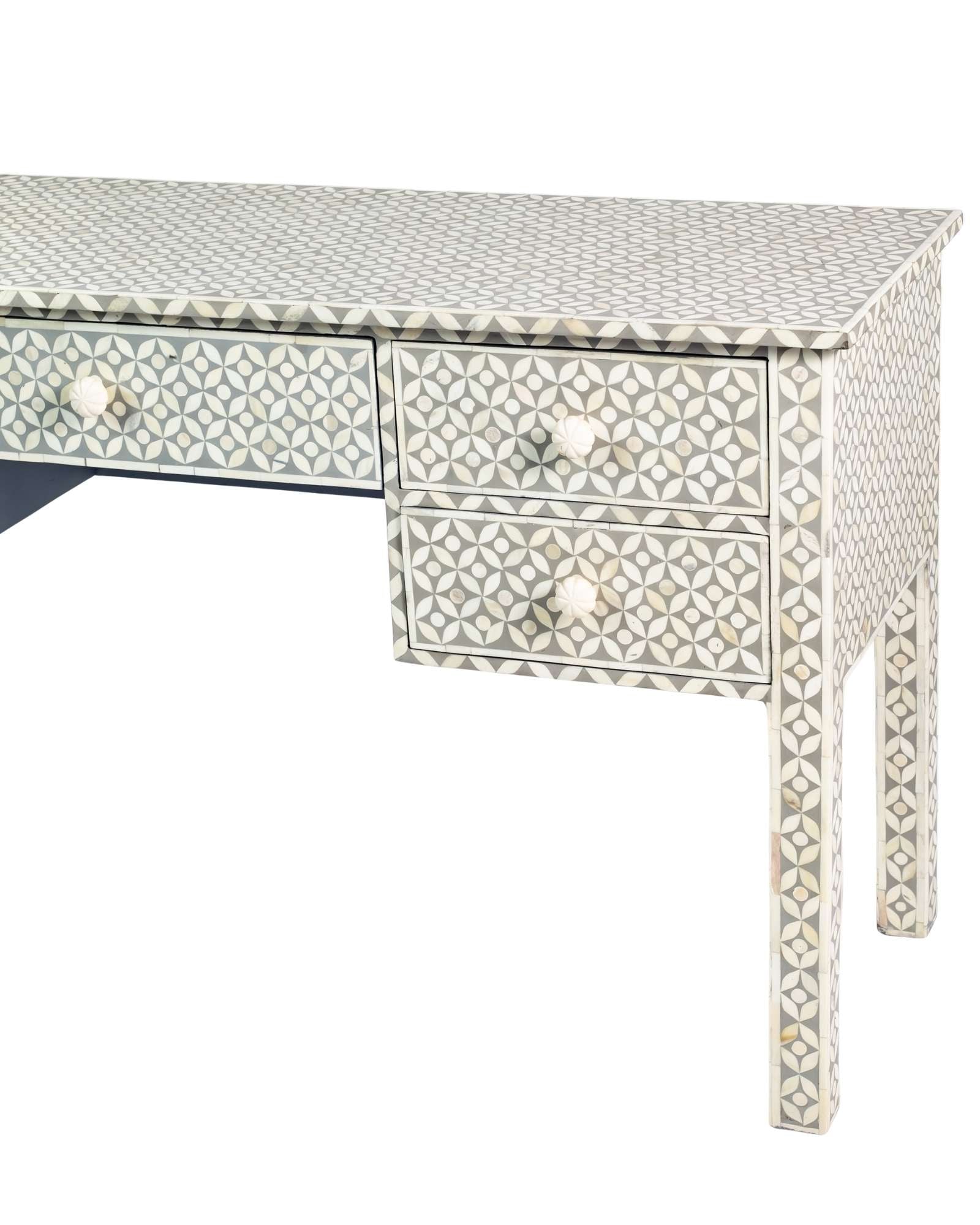Grey bone inlay console desk with five drawers and geometric design, handcrafted with detailed knobs and artisan craftsmanship.