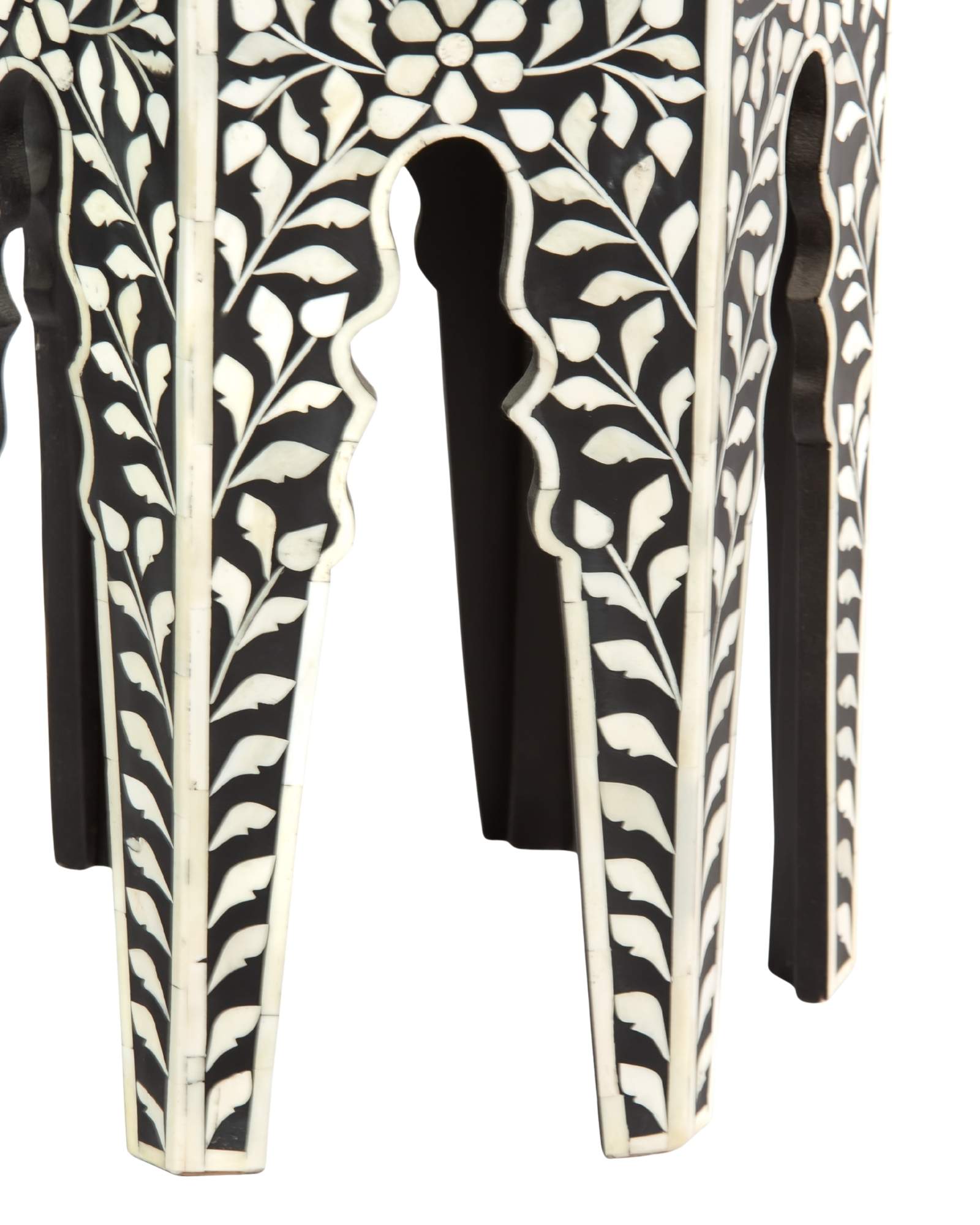 Handcrafted Yasmine side table in black bone inlay with a hexagonal form and arched legs, perfect as a refined accent piece.