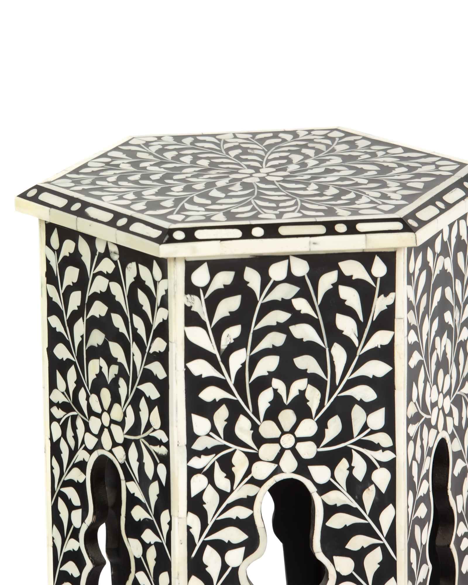 Handcrafted Yasmine side table in black bone inlay with a hexagonal form and arched legs, perfect as a refined accent piece.