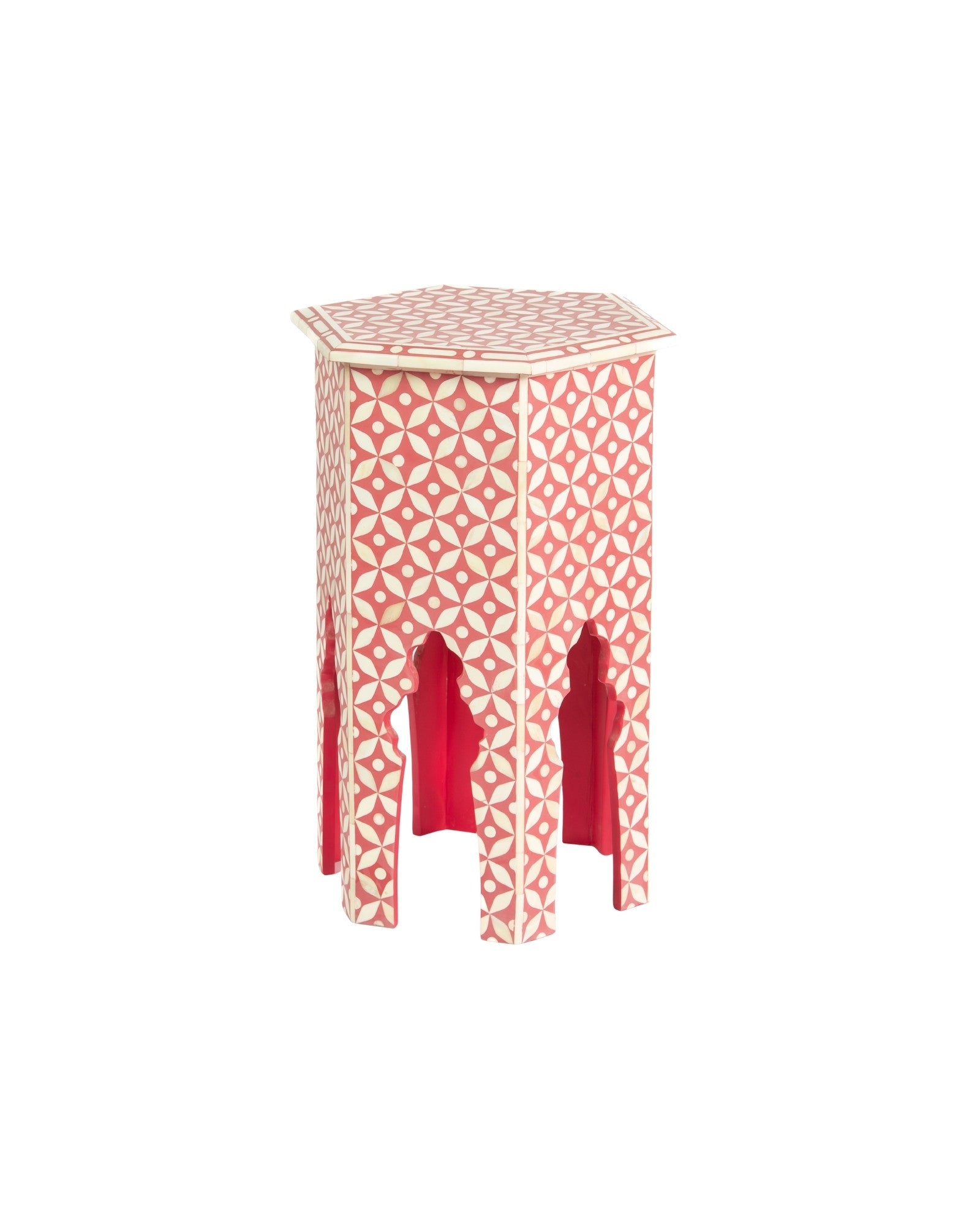 Handcrafted Yasmine side table featuring pink bone inlay with a hexagonal silhouette, geometric detailing, and arched legs.