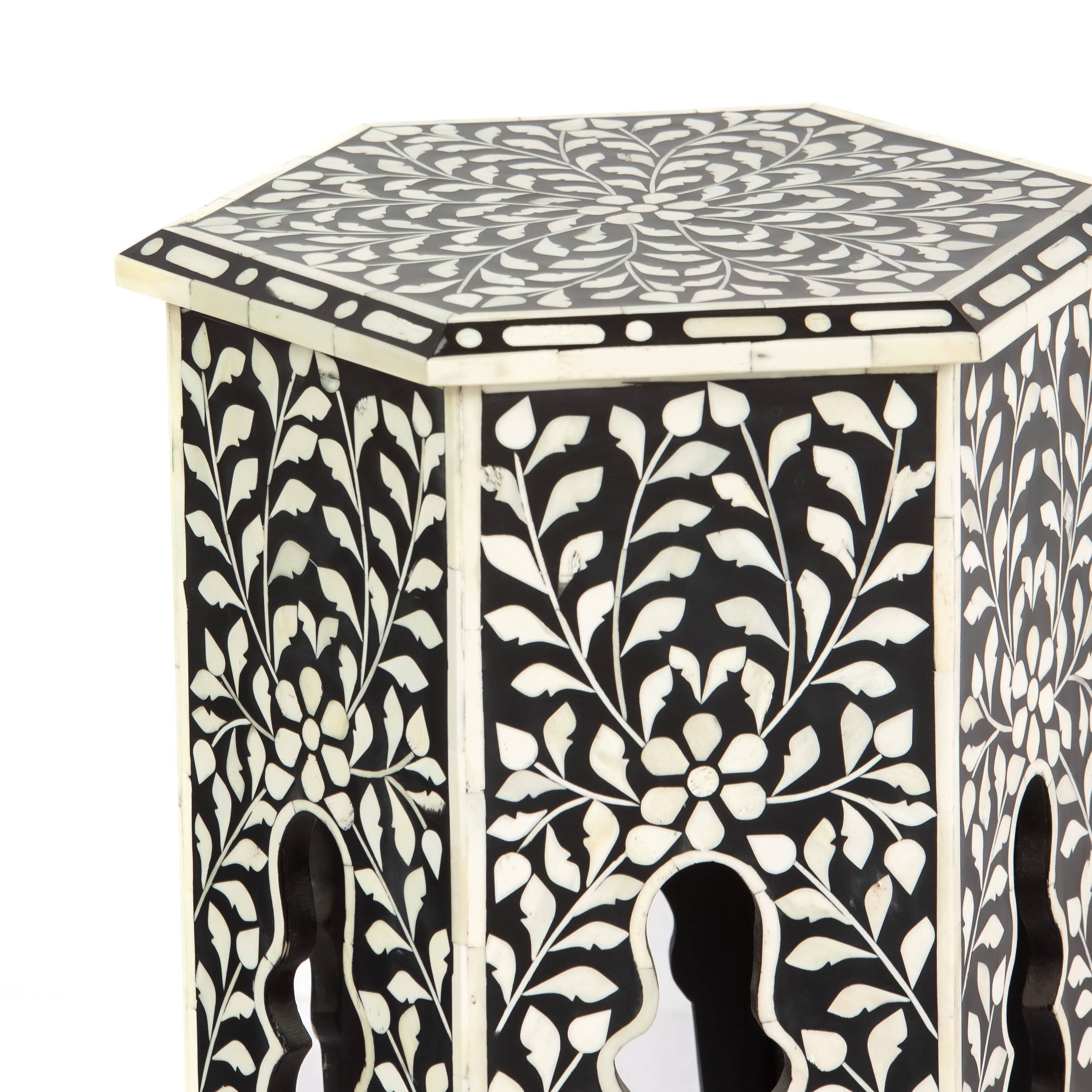 Handcrafted Yasmine side table in black bone inlay with a hexagonal form and arched legs, perfect as a refined accent piece.