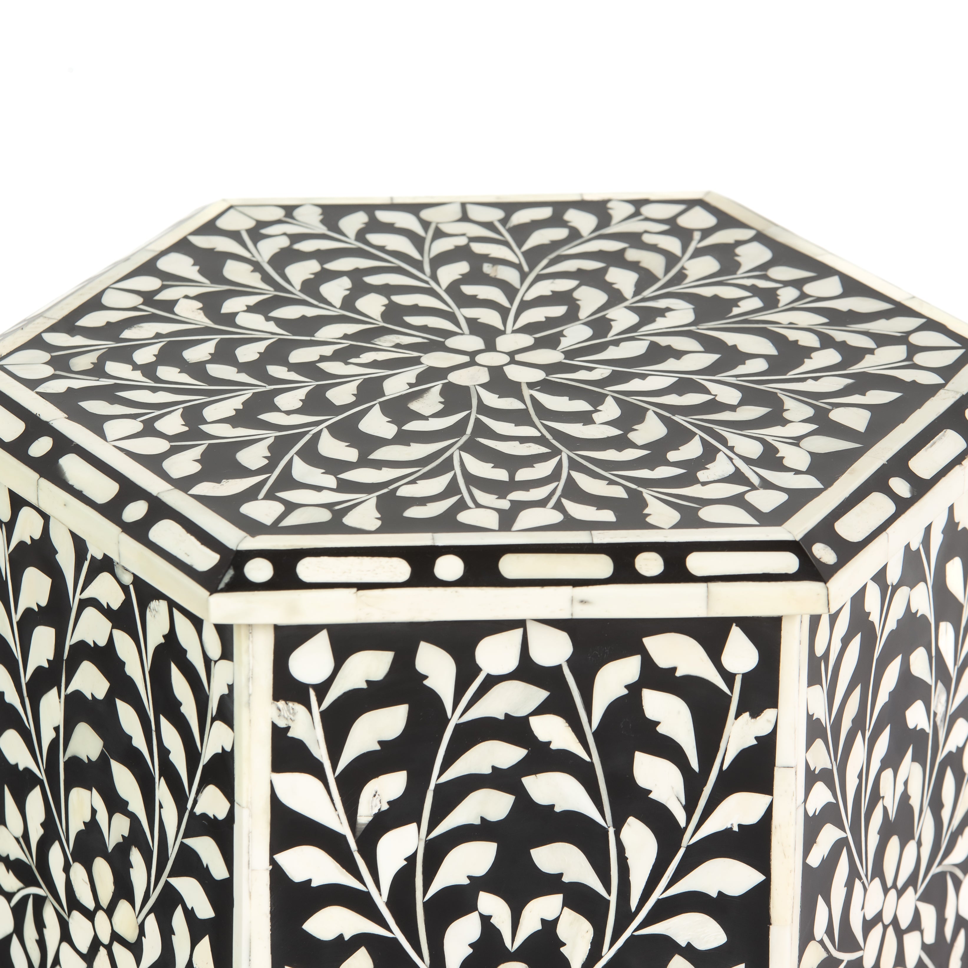 Handcrafted Yasmine side table in black bone inlay with a hexagonal form and arched legs, perfect as a refined accent piece.
