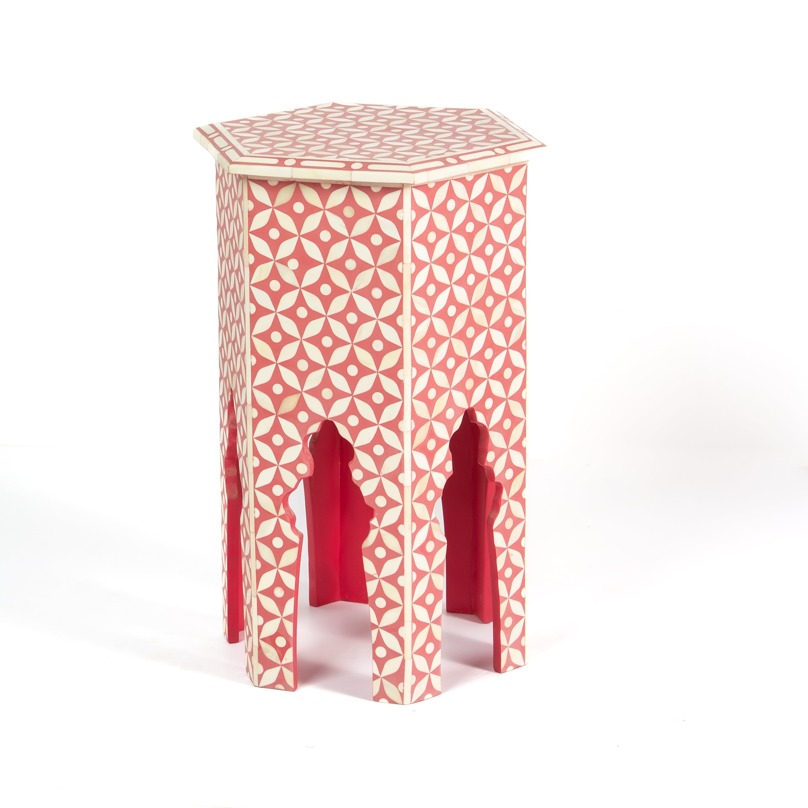 Handcrafted Yasmine side table featuring pink bone inlay with a hexagonal silhouette, geometric detailing, and arched legs.
