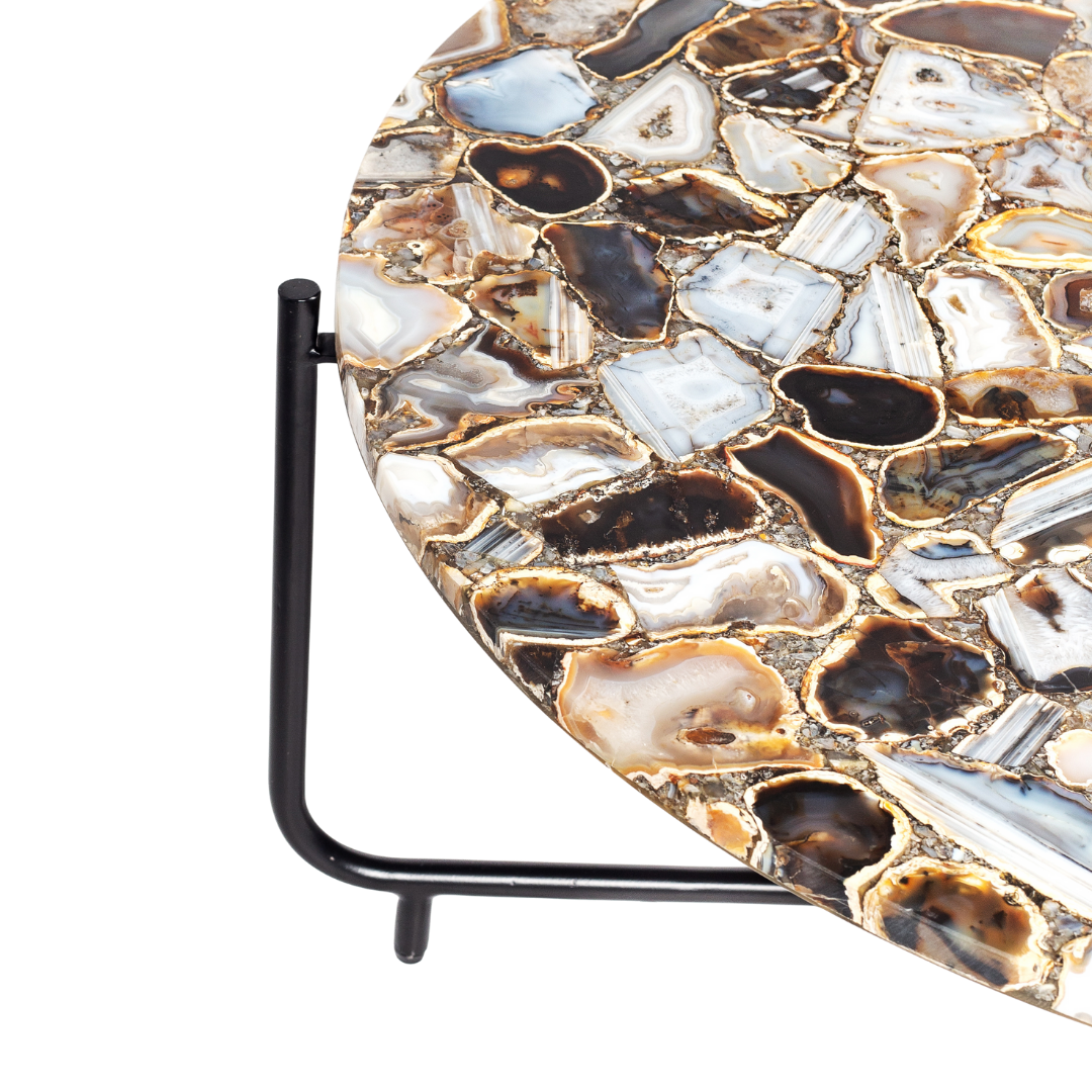 Round coffee table with genuine agate stone top and sleek black metal base, modern and luxurious centerpiece design.