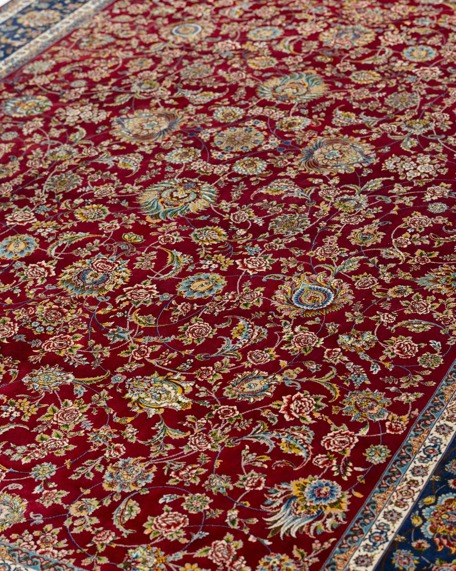 Alessia Persian silk rug folded corner showing fine weave, ruby red 200 x 300 cm - Tabeer Homes Dubai