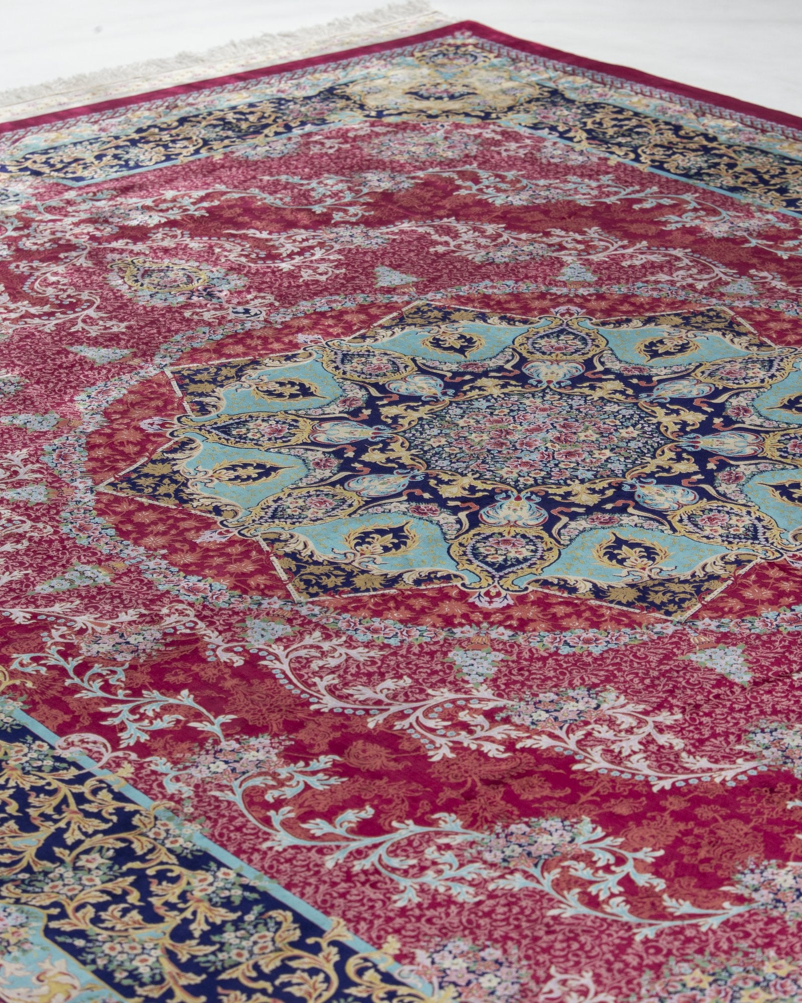Almeria Persian silk rug centre medallion close-up, ruby red 250 x 350 cm - Tabeer Homes Dubai