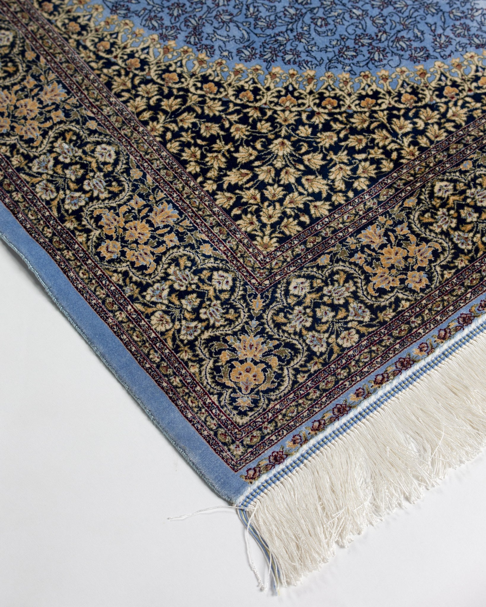 Corner of the Aseman blue silk rug border