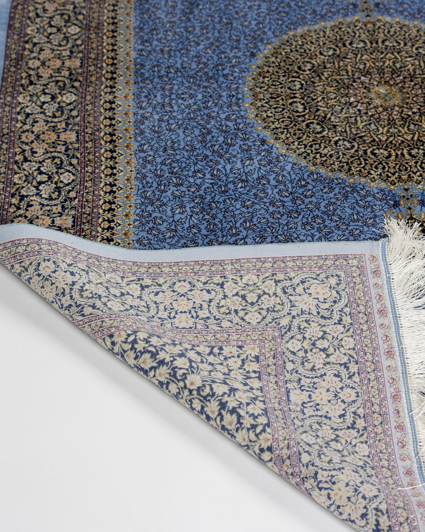 Angled view of the Aseman silk rug field