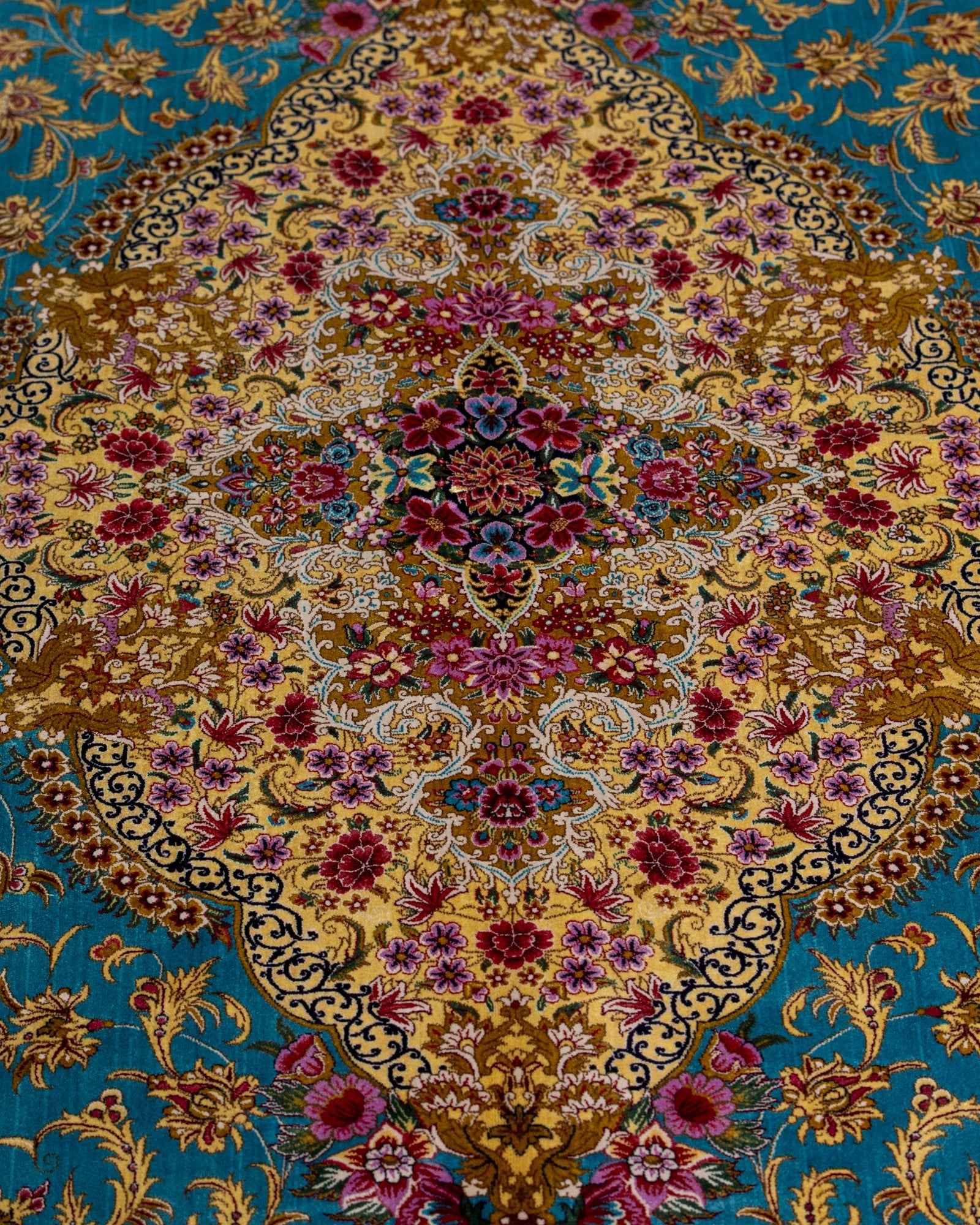 corner with silk fringe on the Aurelia teal silk rug