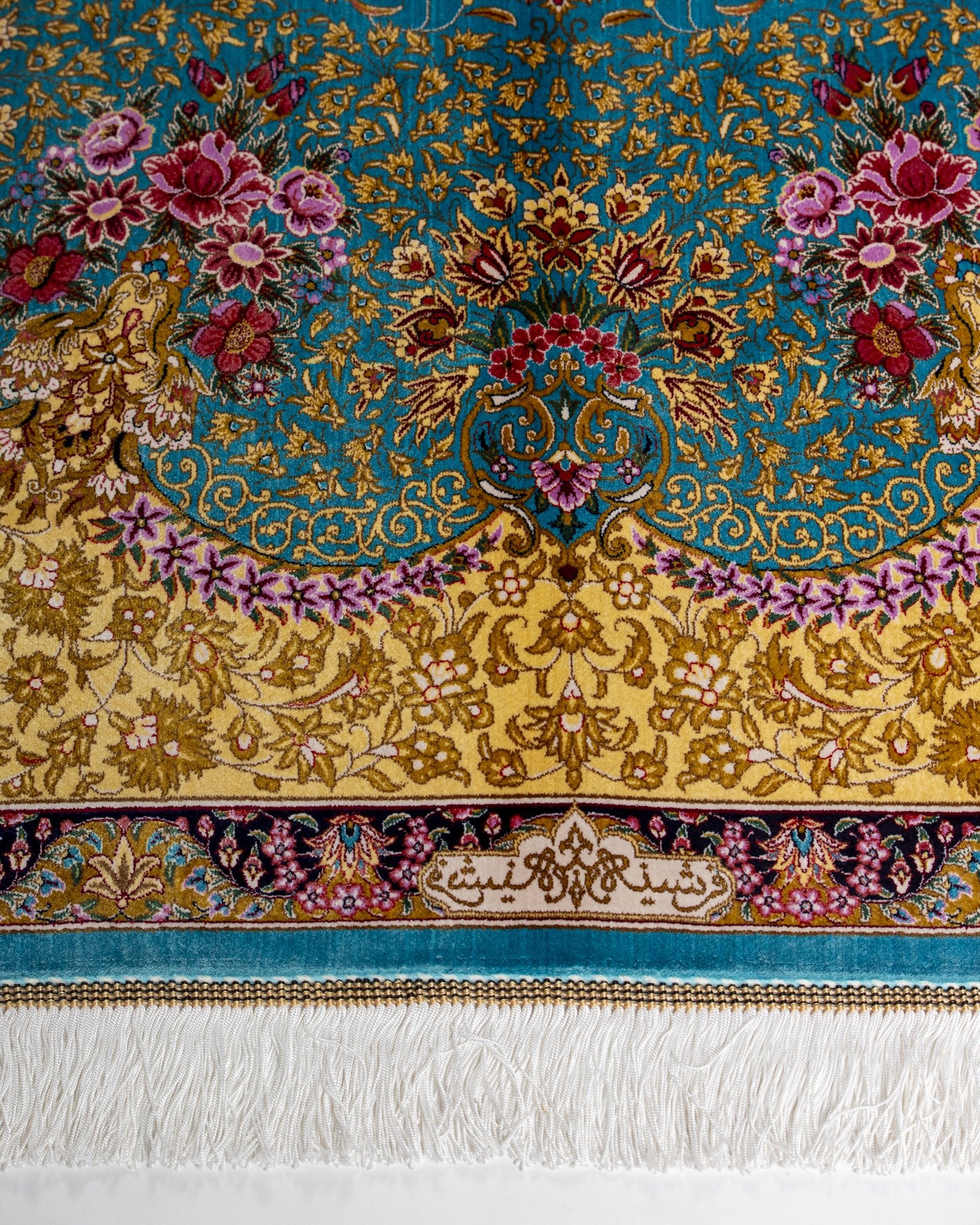 border pattern detail on the Aurelia teal silk rug