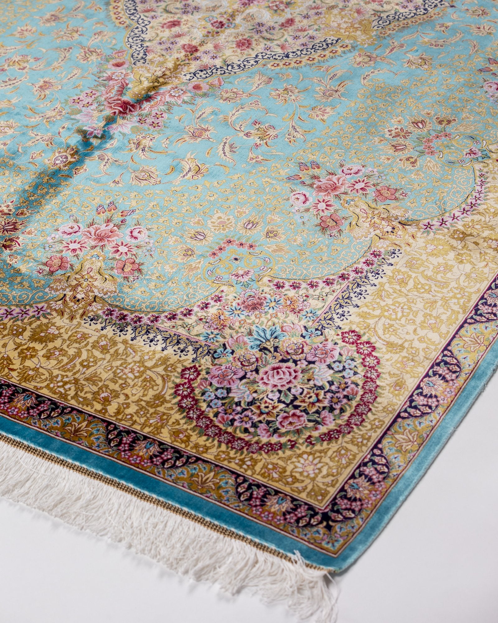 reverse showing the fine silk weave on the Aurelia teal silk rug