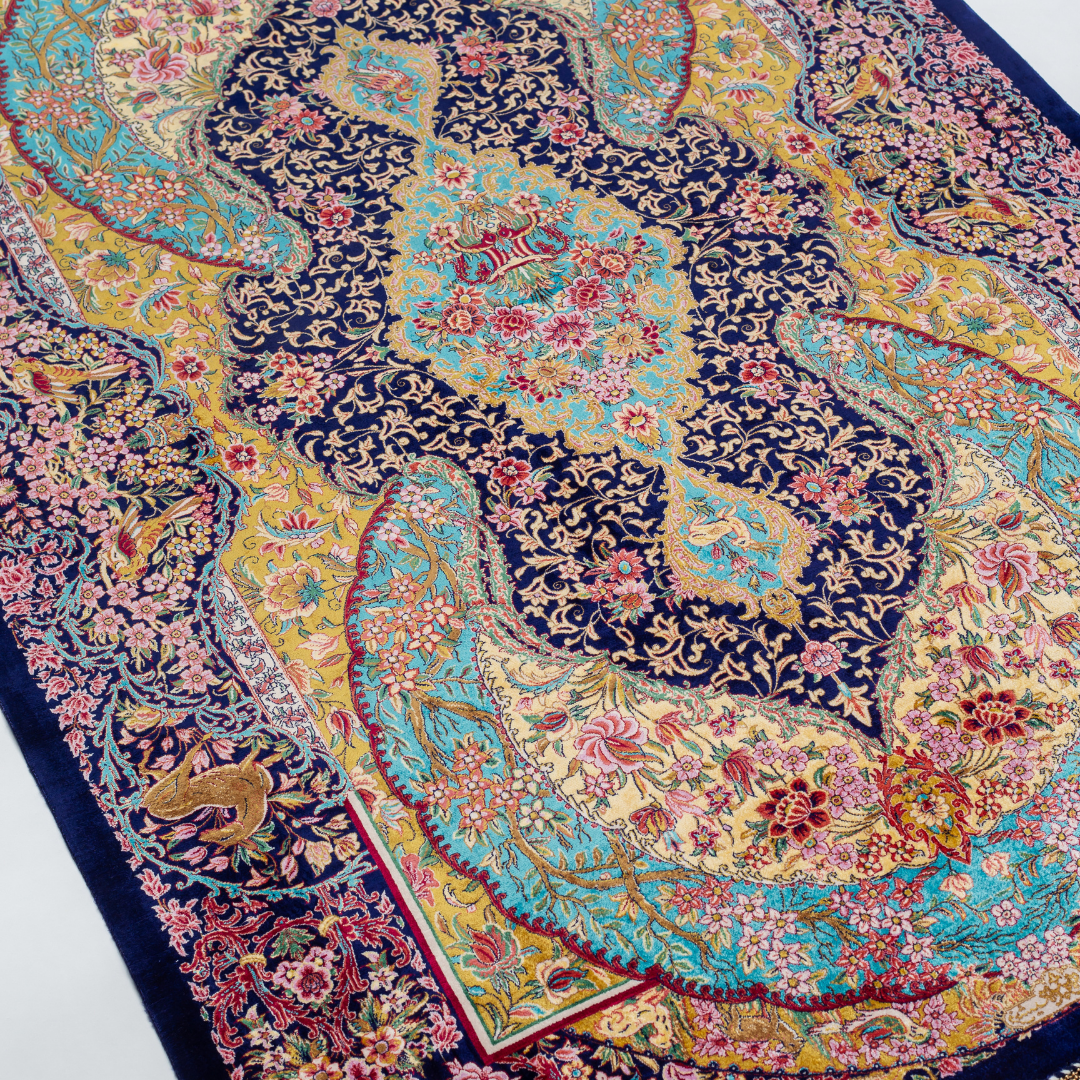 Azmin Silk Rug featuring navy base with gold vines, teal medallions, and pink floral detailing, 150x100 cm.