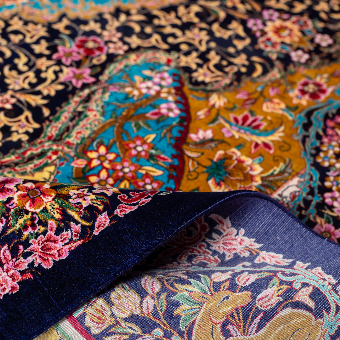 Azmin Silk Rug featuring navy base with gold vines, teal medallions, and pink floral detailing, 150x100 cm.