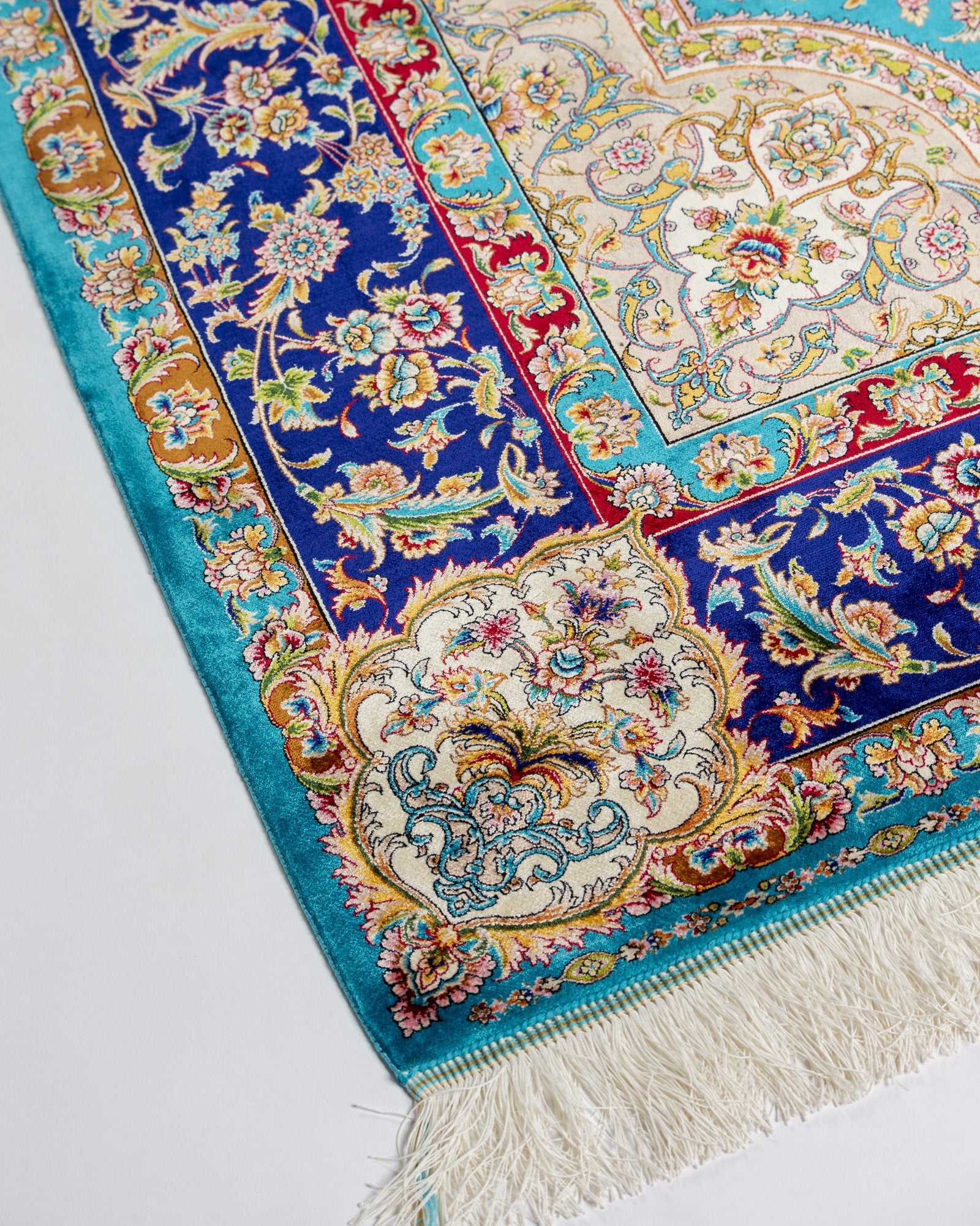 detail of the central medallion on the Marina turquoise silk rug