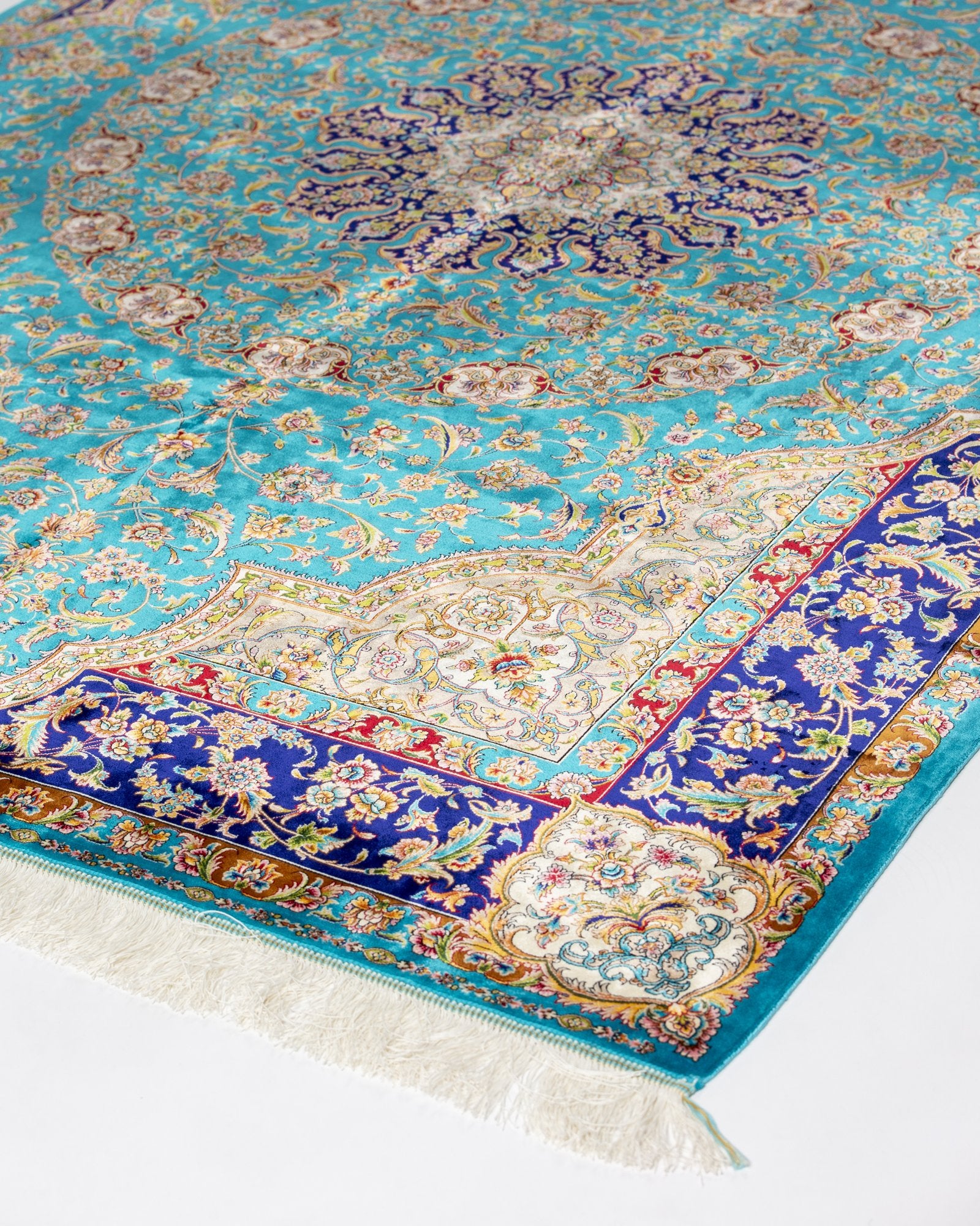 border and field detail on the Marina turquoise silk rug