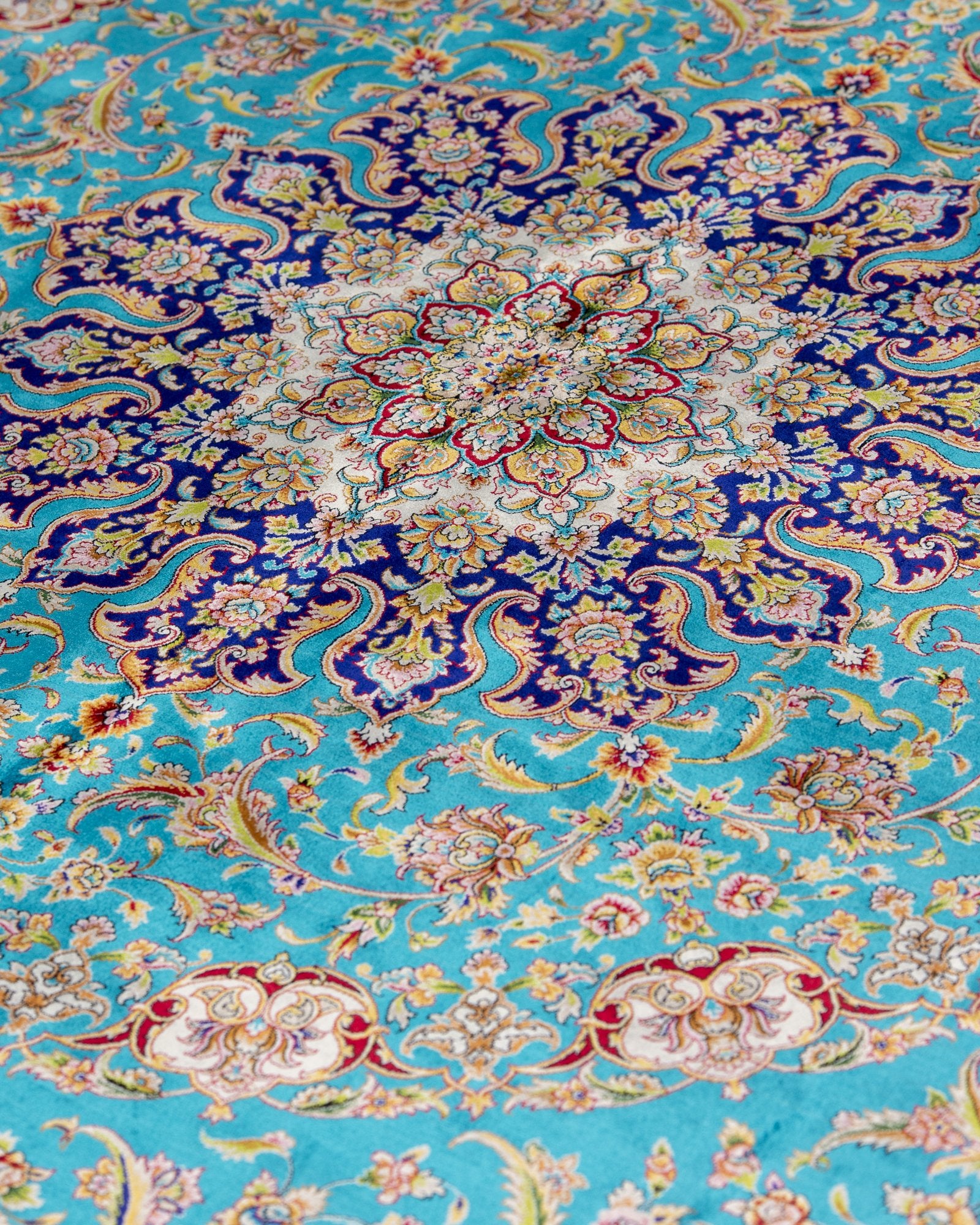 corner with silk fringe on the Marina turquoise silk rug