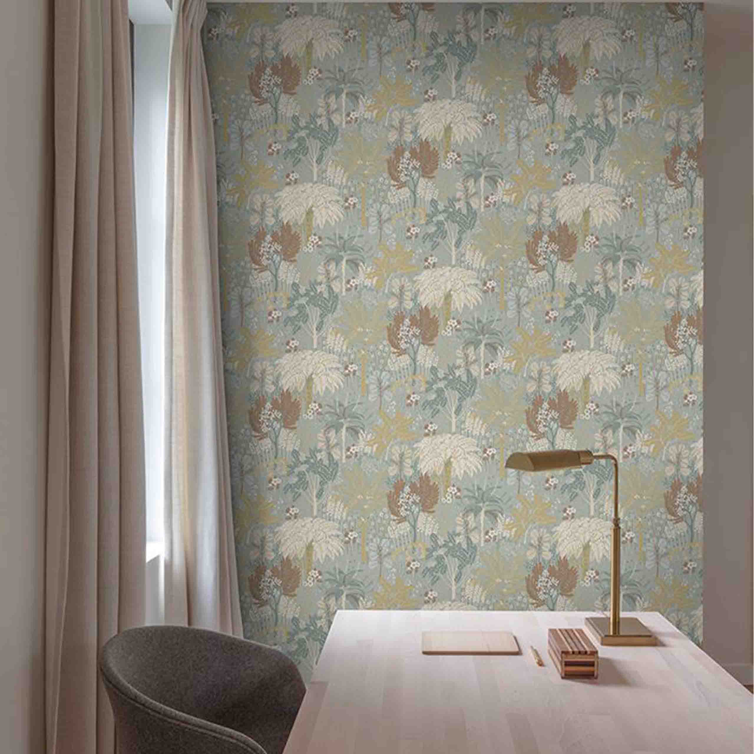 Azurea wallpaper displayed in a modern room, showcasing soft botanical and floral motifs in a soothing palette of blue, beige, and green. 