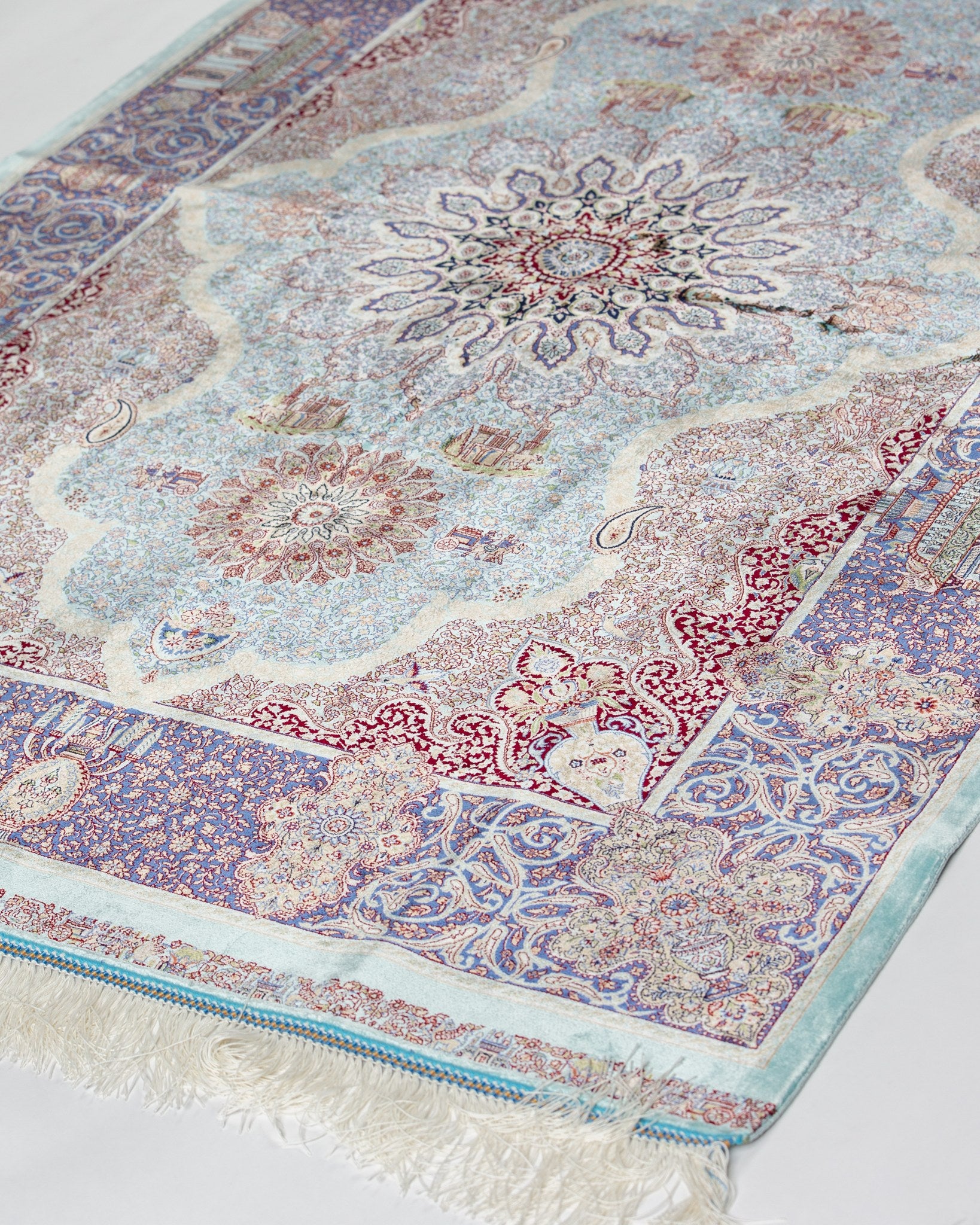 Angled view of the Banafsheh silk rug with border