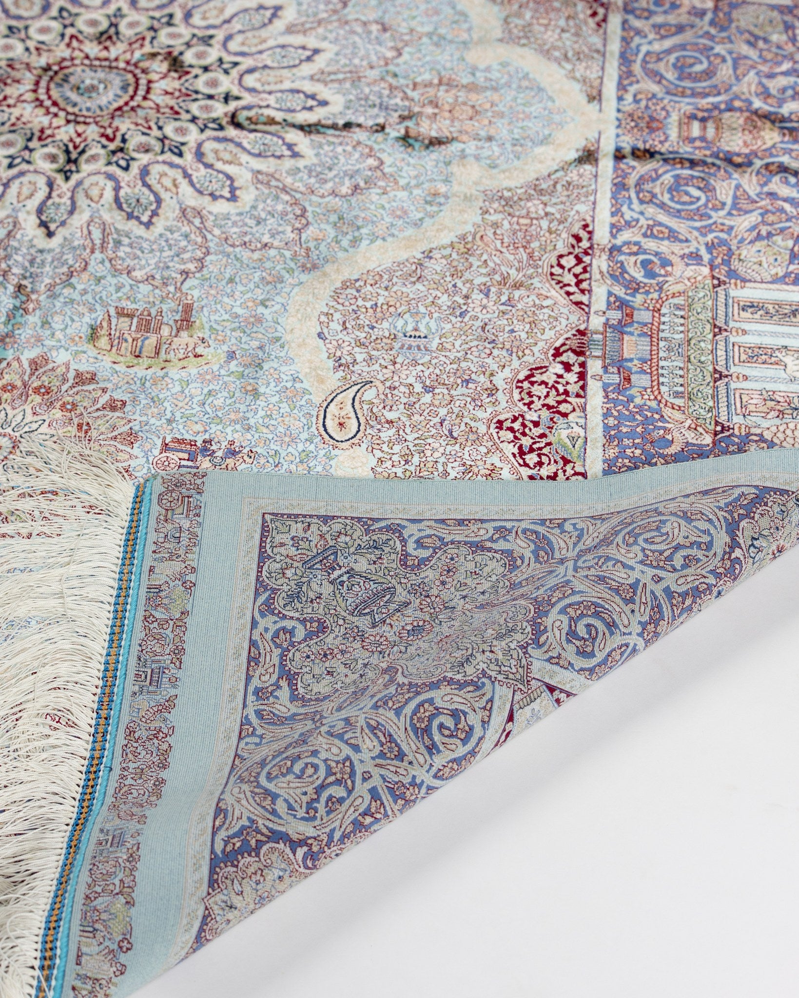 Banafsheh teal silk rug corner detail