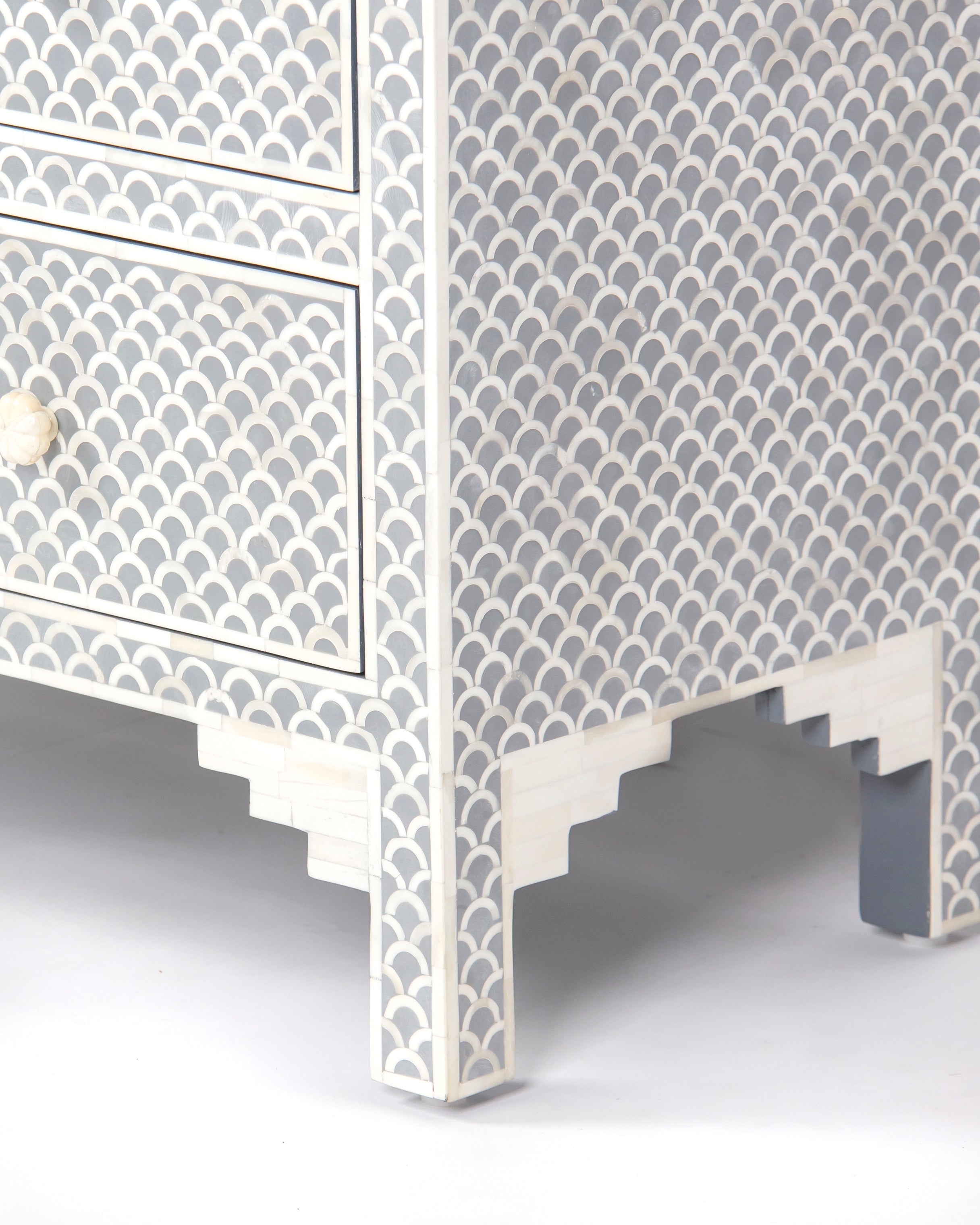 Stepped apron and leg detail with fish scale inlay on Basel chest