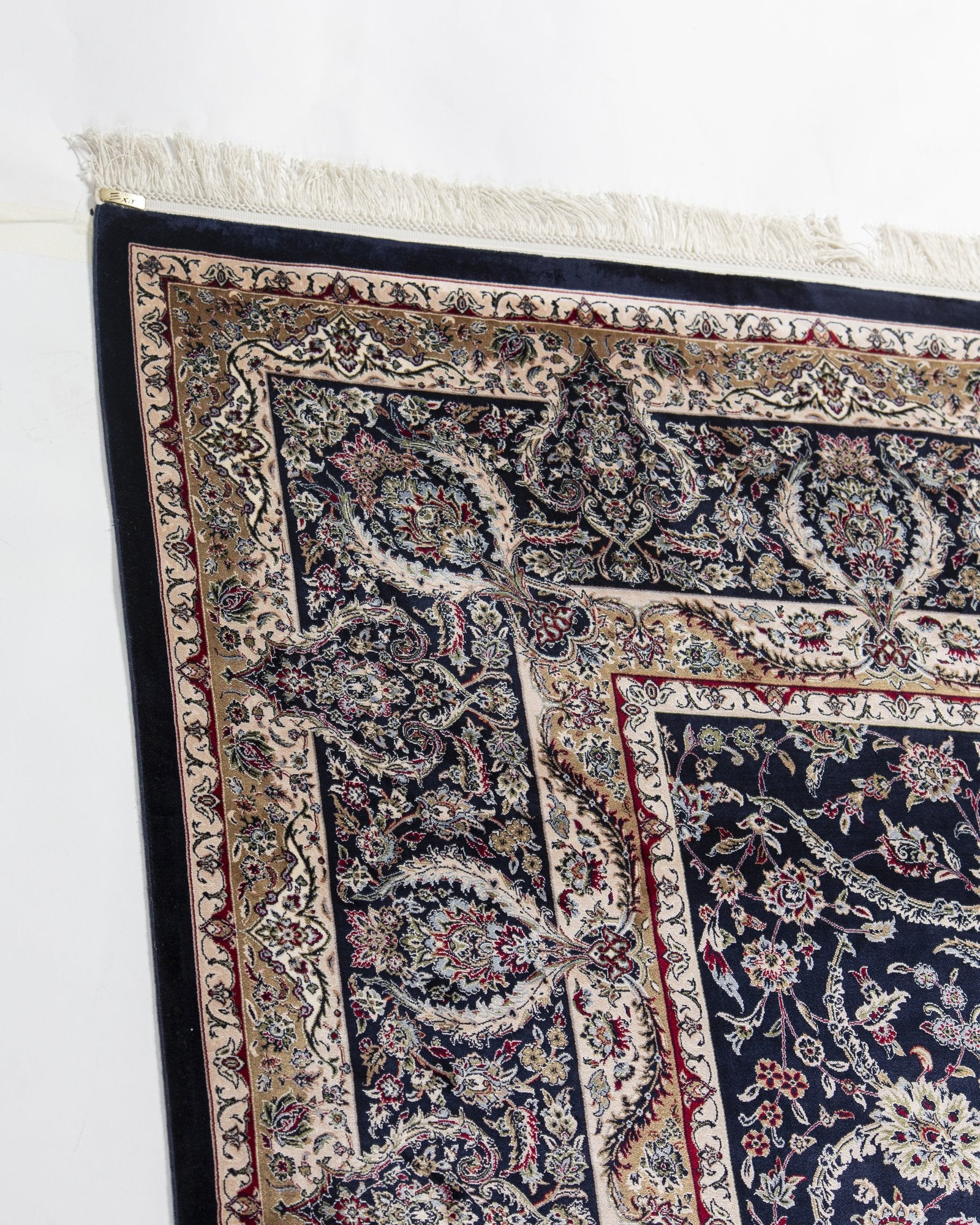 Cyrene silk carpet angled view showing midnight navy tones, 250 x 350 cm - Tabeer Homes Dubai