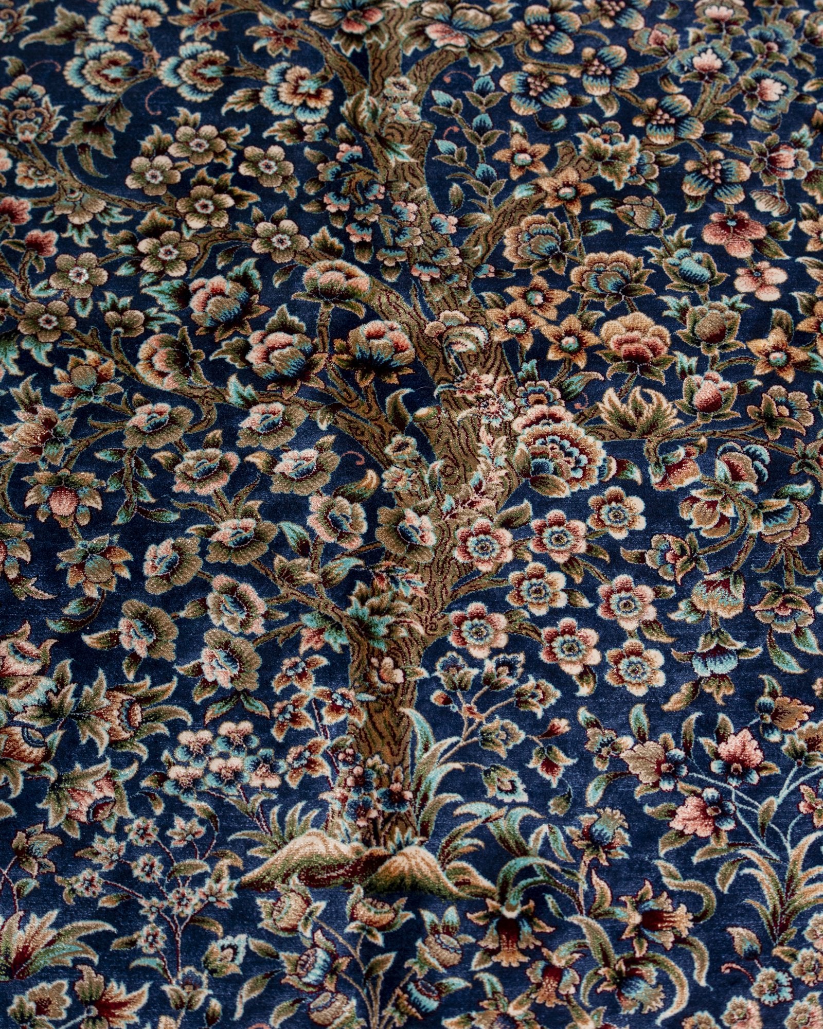 corner with silk fringe on the Delkash blue silk rug