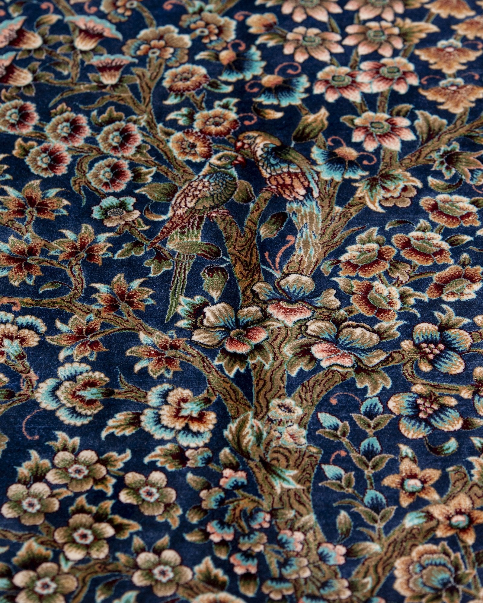 border pattern detail on the Delkash blue silk rug