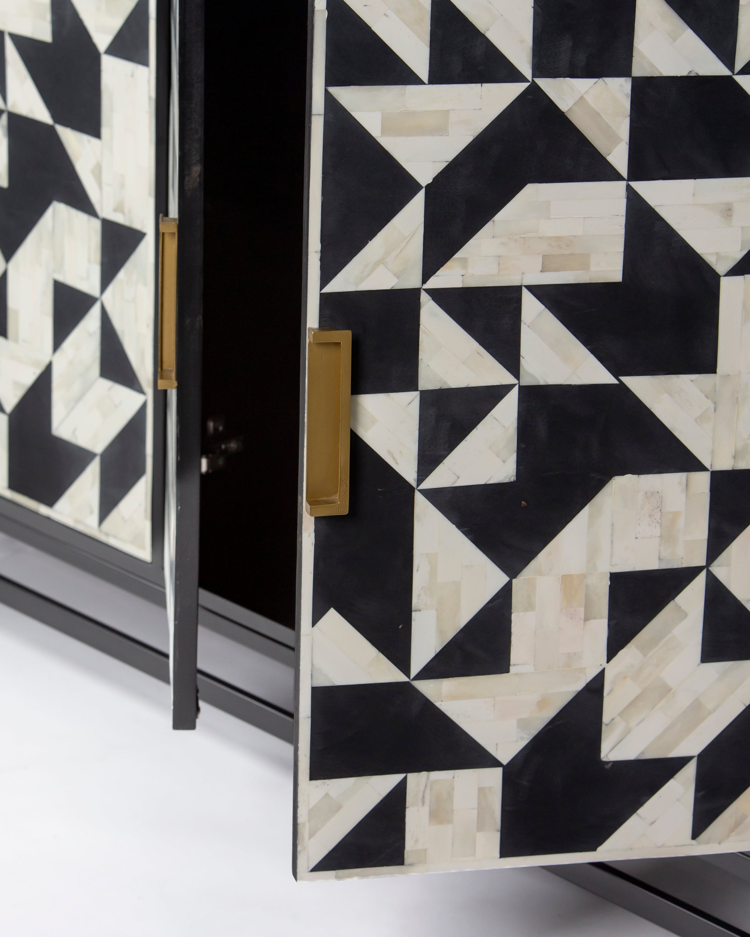 Open door edge with geometric bone inlay on Eve cabinet