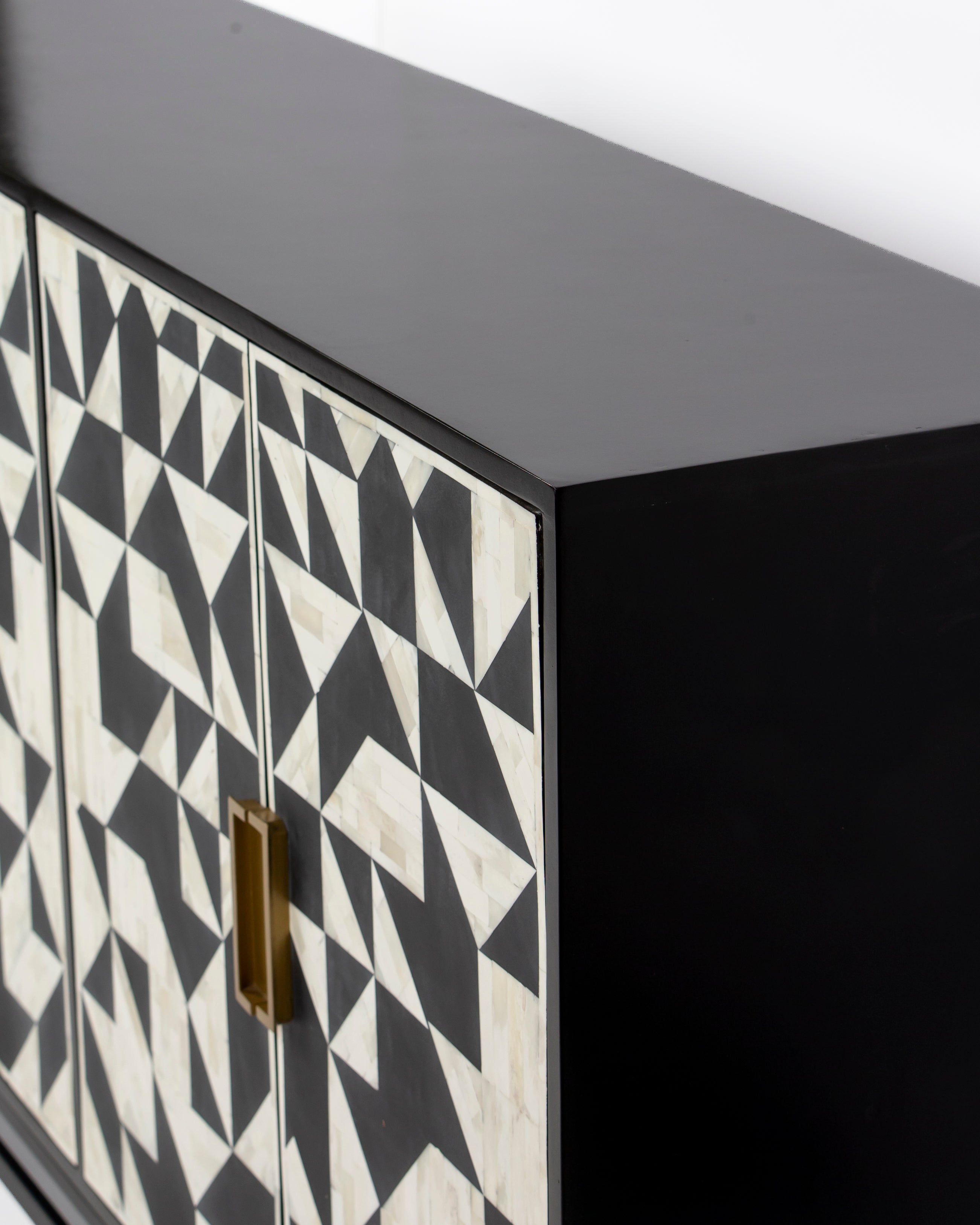 Top corner and black frame detail of Eve bone inlay cabinet