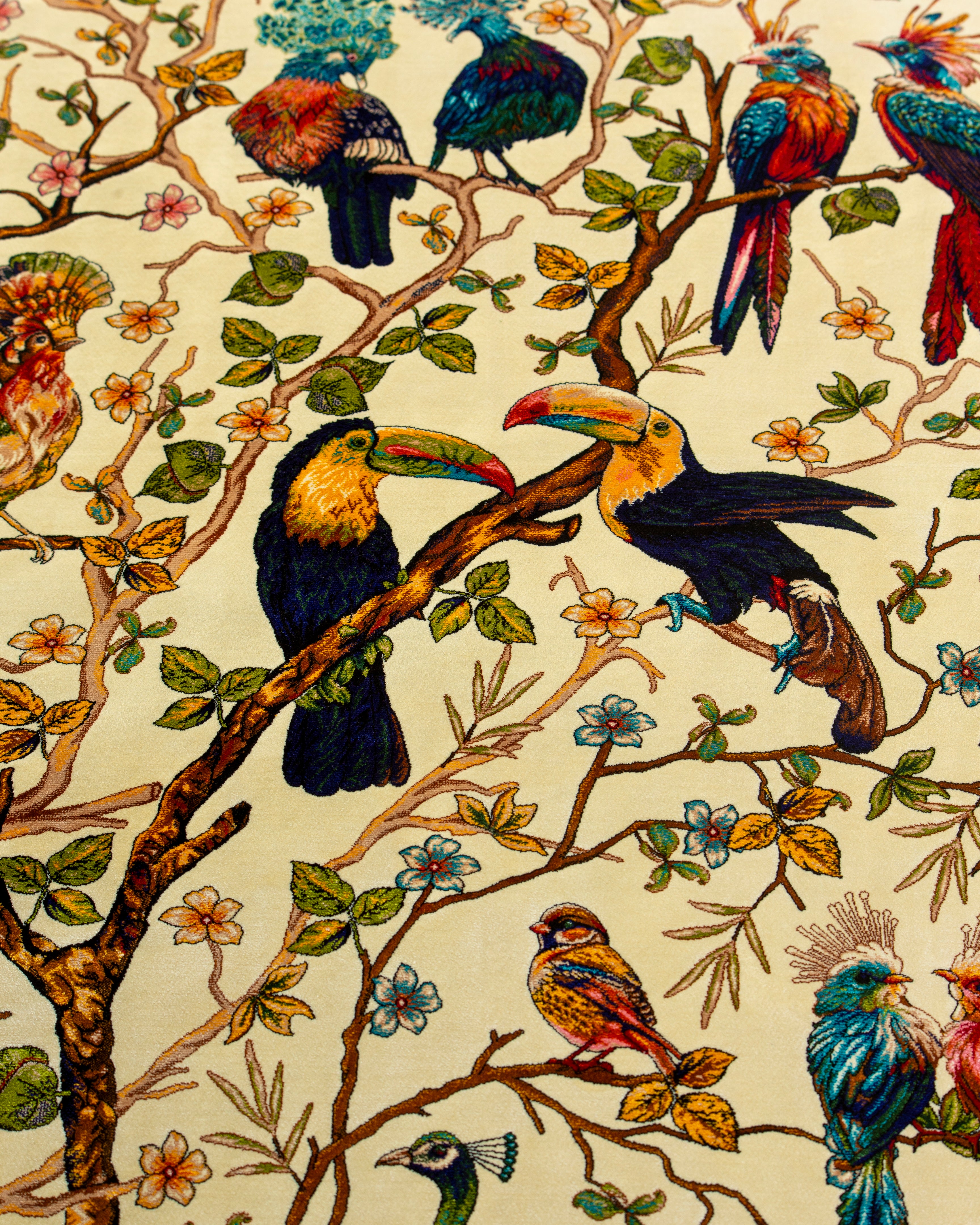 Colourful birds detail on the Firdaus silk rug