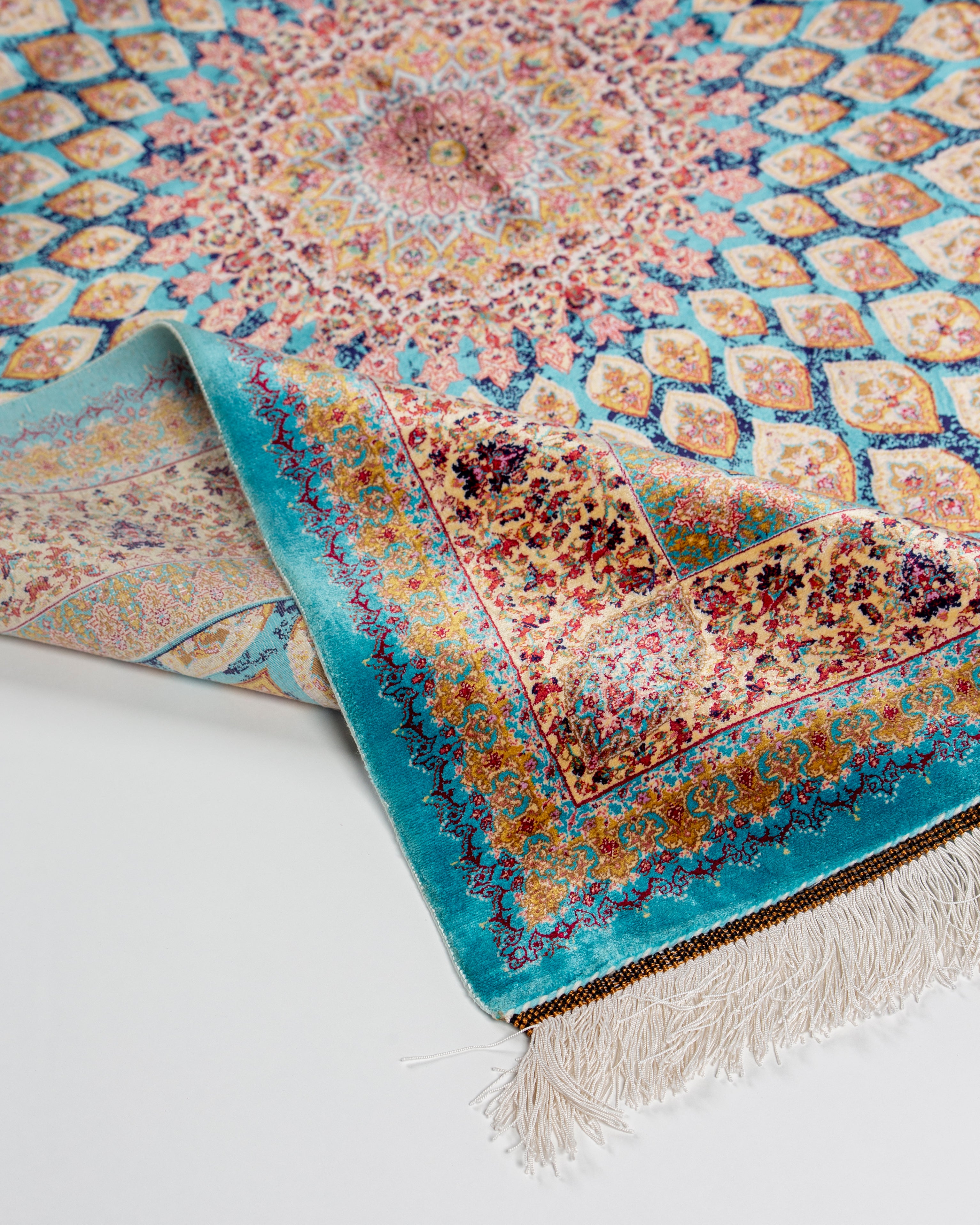 Corner and border detail of the Firuzeh silk rug